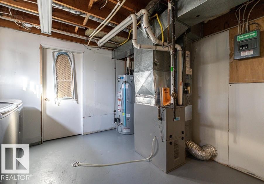 Utility area featuring a furnace, water heater, and painted concrete flooring - 71 Labelle Crescent, St. Albert, AB - Indoor Photo Showing Basement
