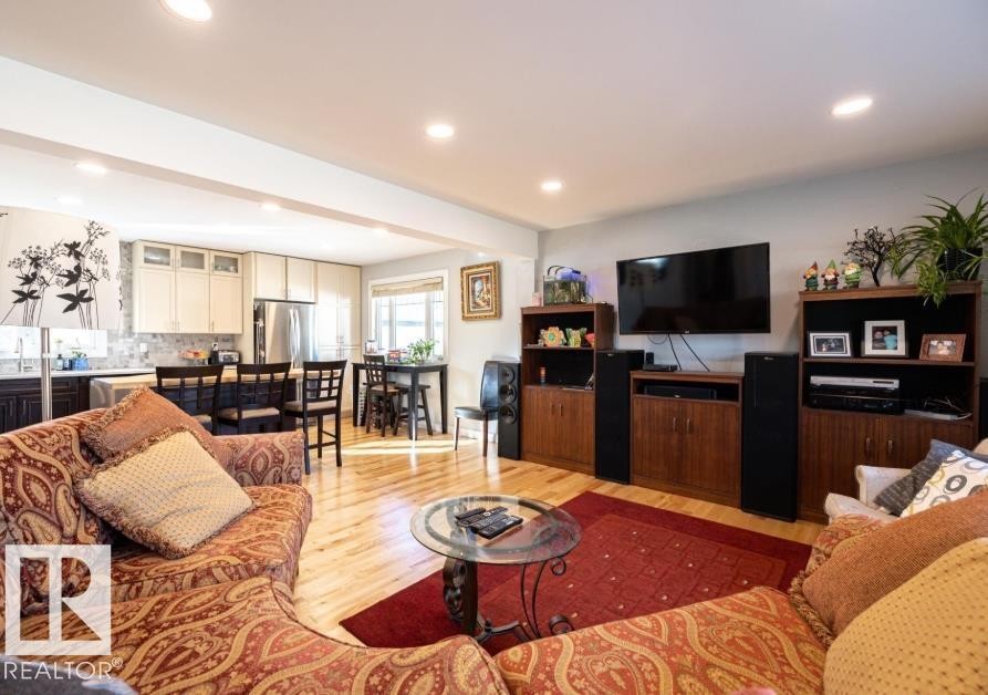 The property features hardwood flooring throughout the main living area - 71 Labelle Crescent, St. Albert, AB - Indoor Photo Showing Living Room