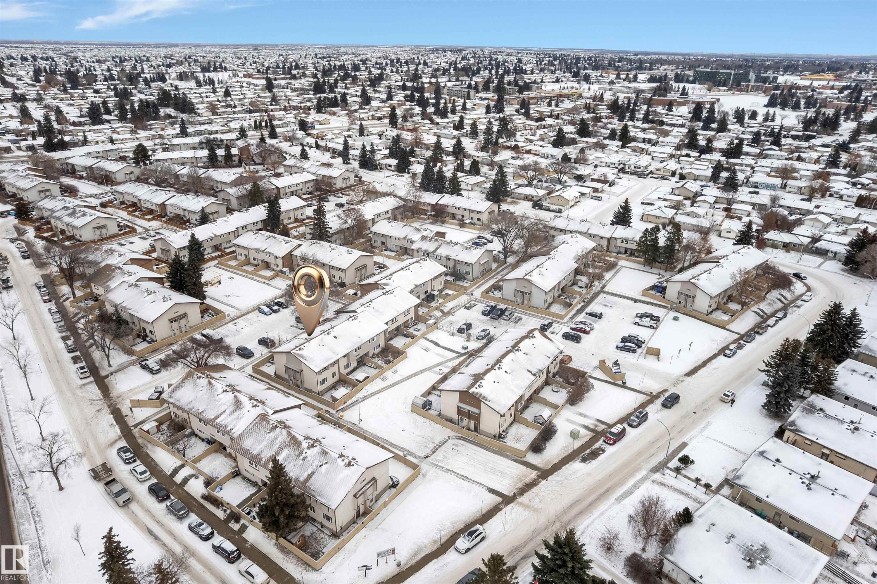 Aerial perspective showcasing a residential community with numerous townhome-style residences - 7 14115 82 Street, Edmonton, AB -