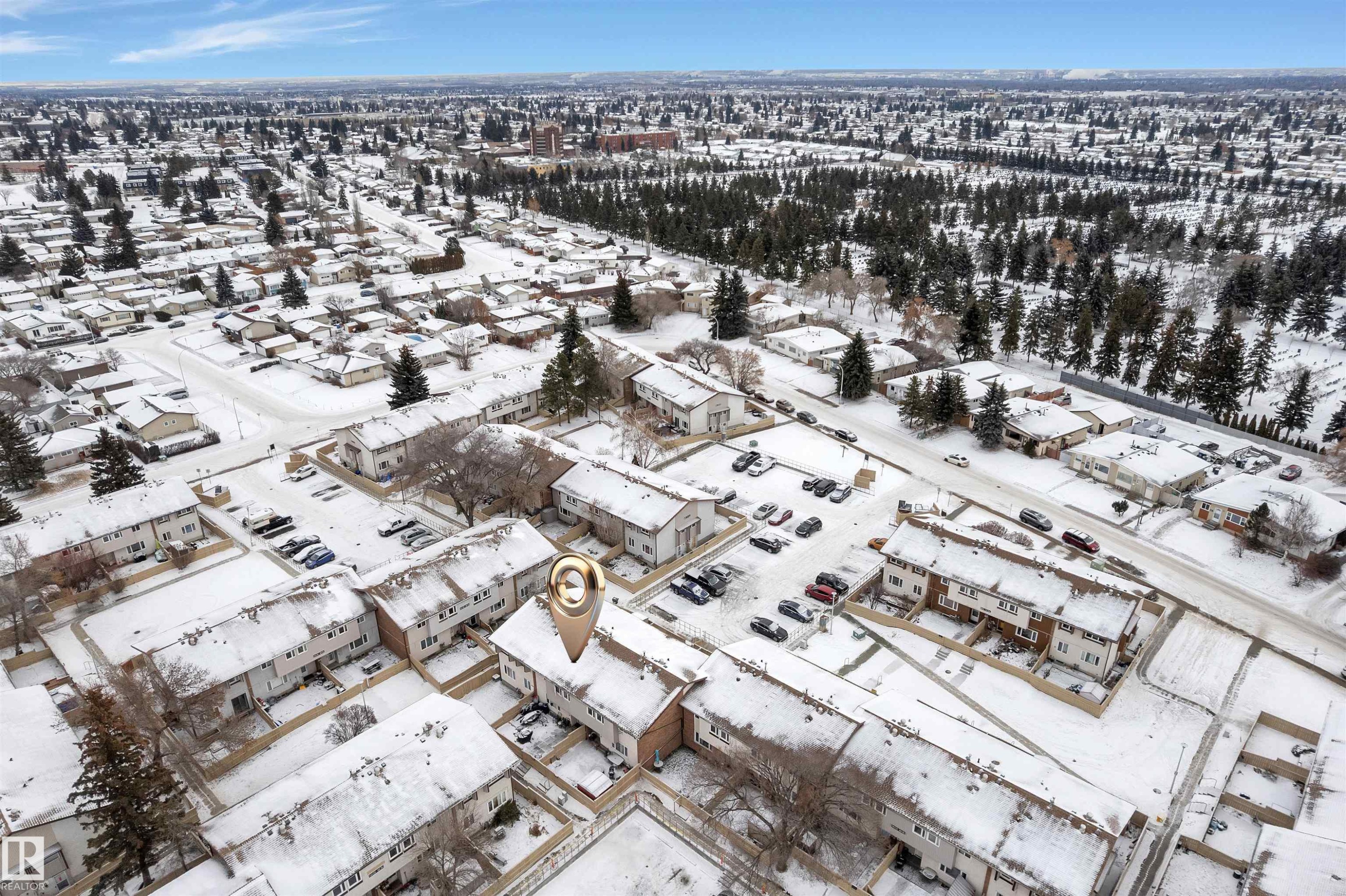 Aerial view of a residential area featuring multiple attached housing units with snow-covered roofs - 7 14115 82 Street, Edmonton, AB - Outdoor With View