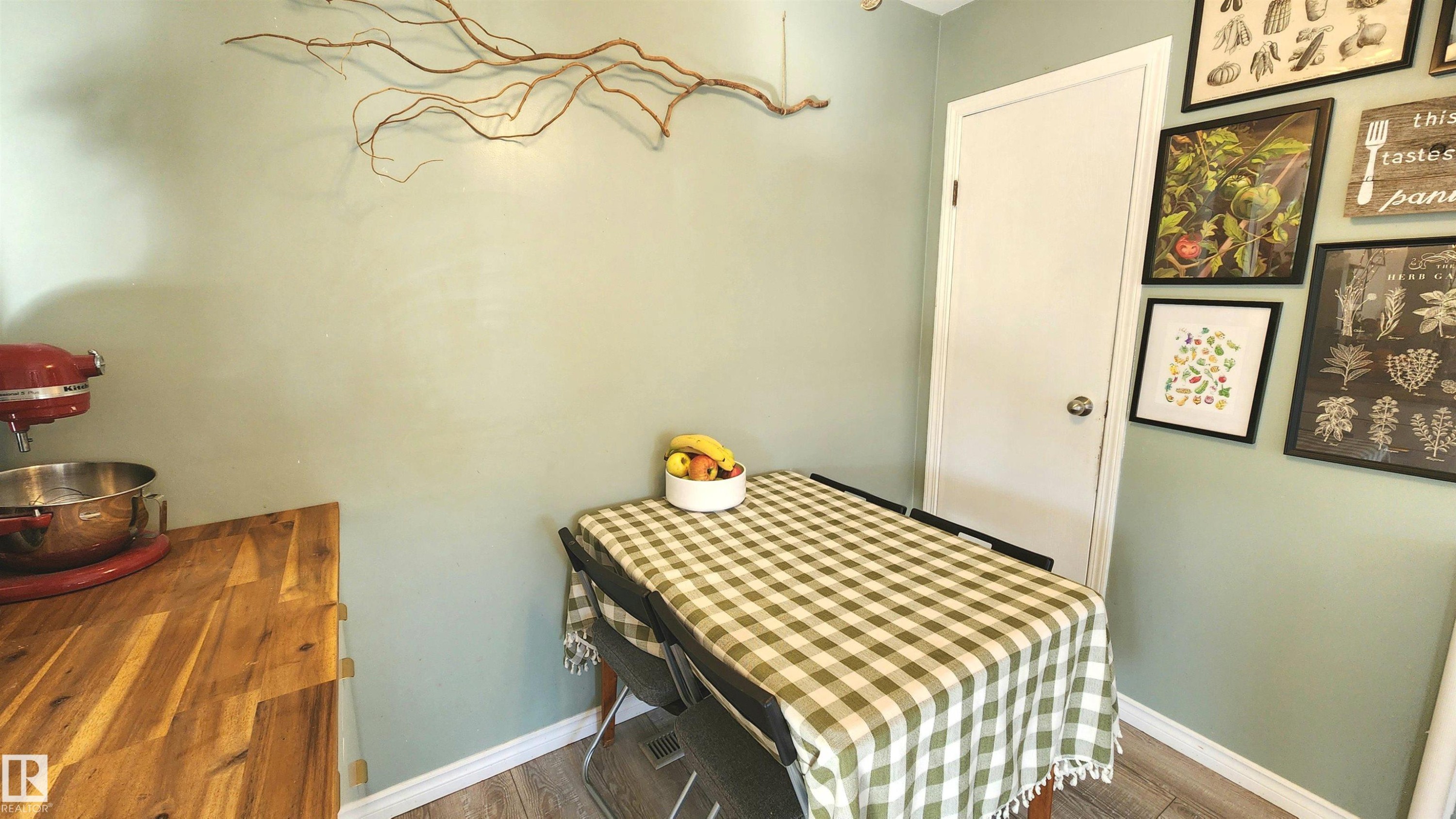 Wood-finish flooring paired with light green walls - 3531 46 Street, Edmonton, AB - Indoor