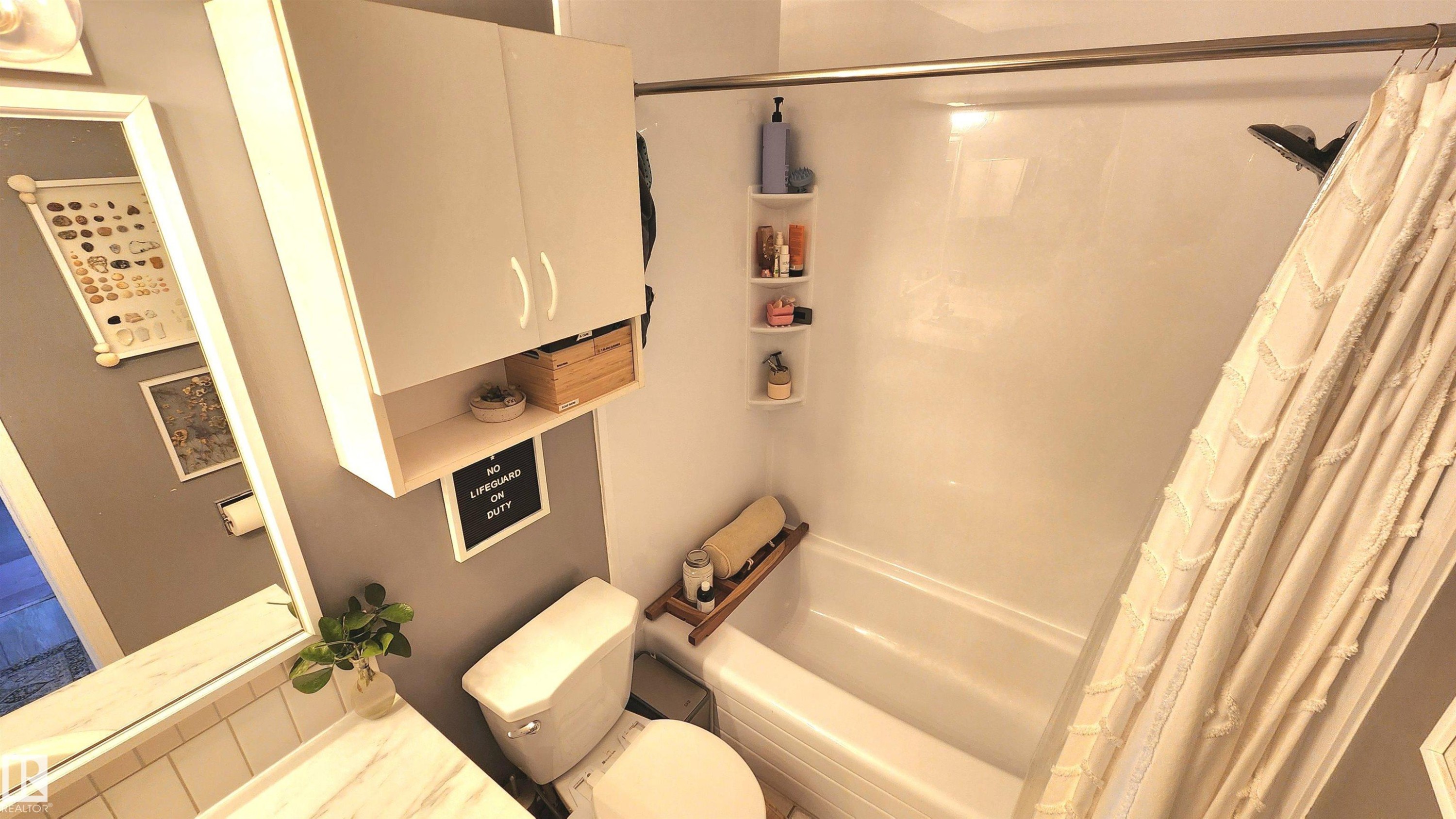 Full bathroom featuring a white tub and shower combination with a curved shower rod - 3531 46 Street, Edmonton, AB - Indoor Photo Showing Other Room