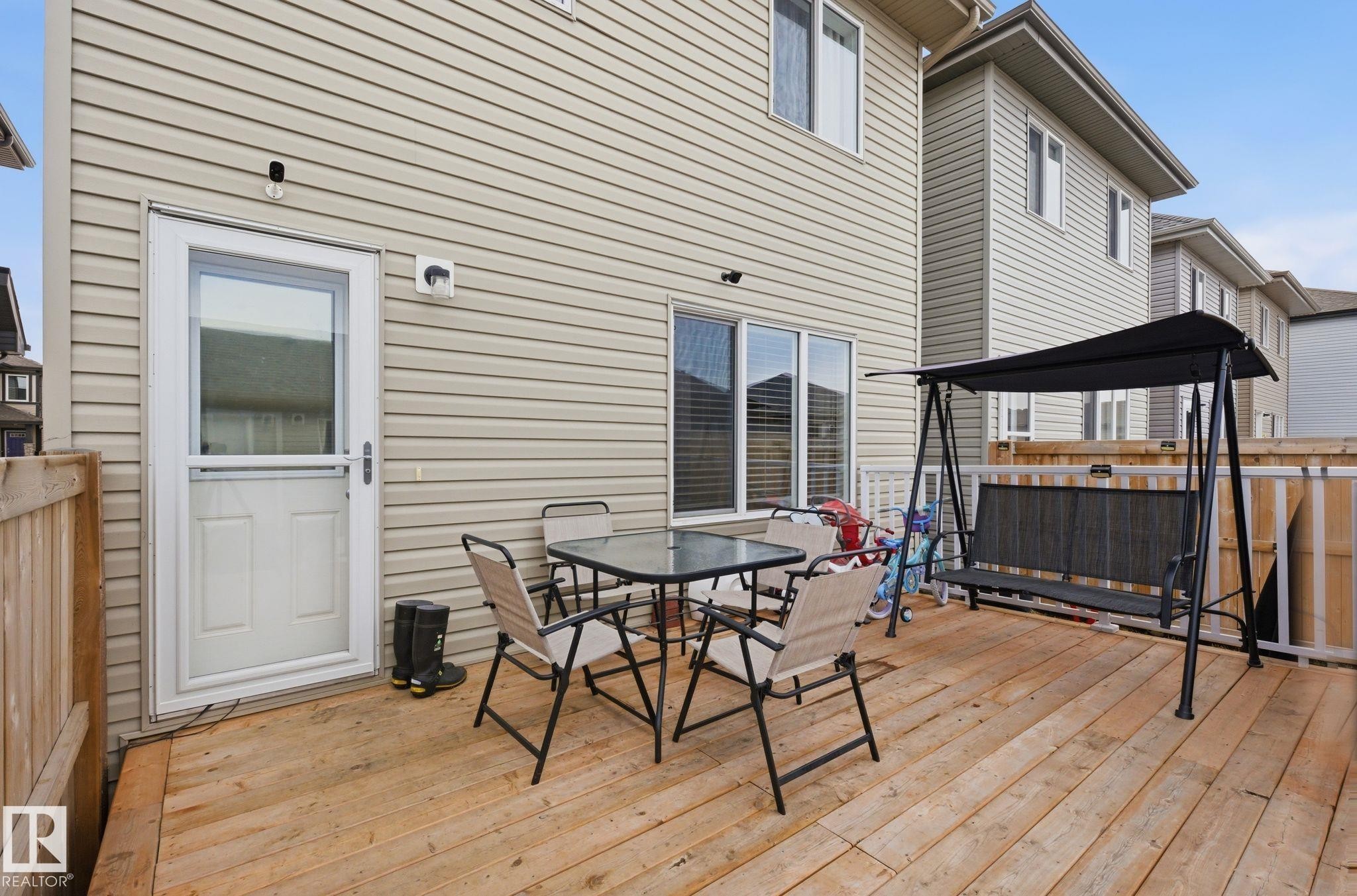 The property features a private wood deck, offering an outdoor living space - 4636 175 Ave, Edmonton, AB - Outdoor With Deck Patio Veranda With Exterior