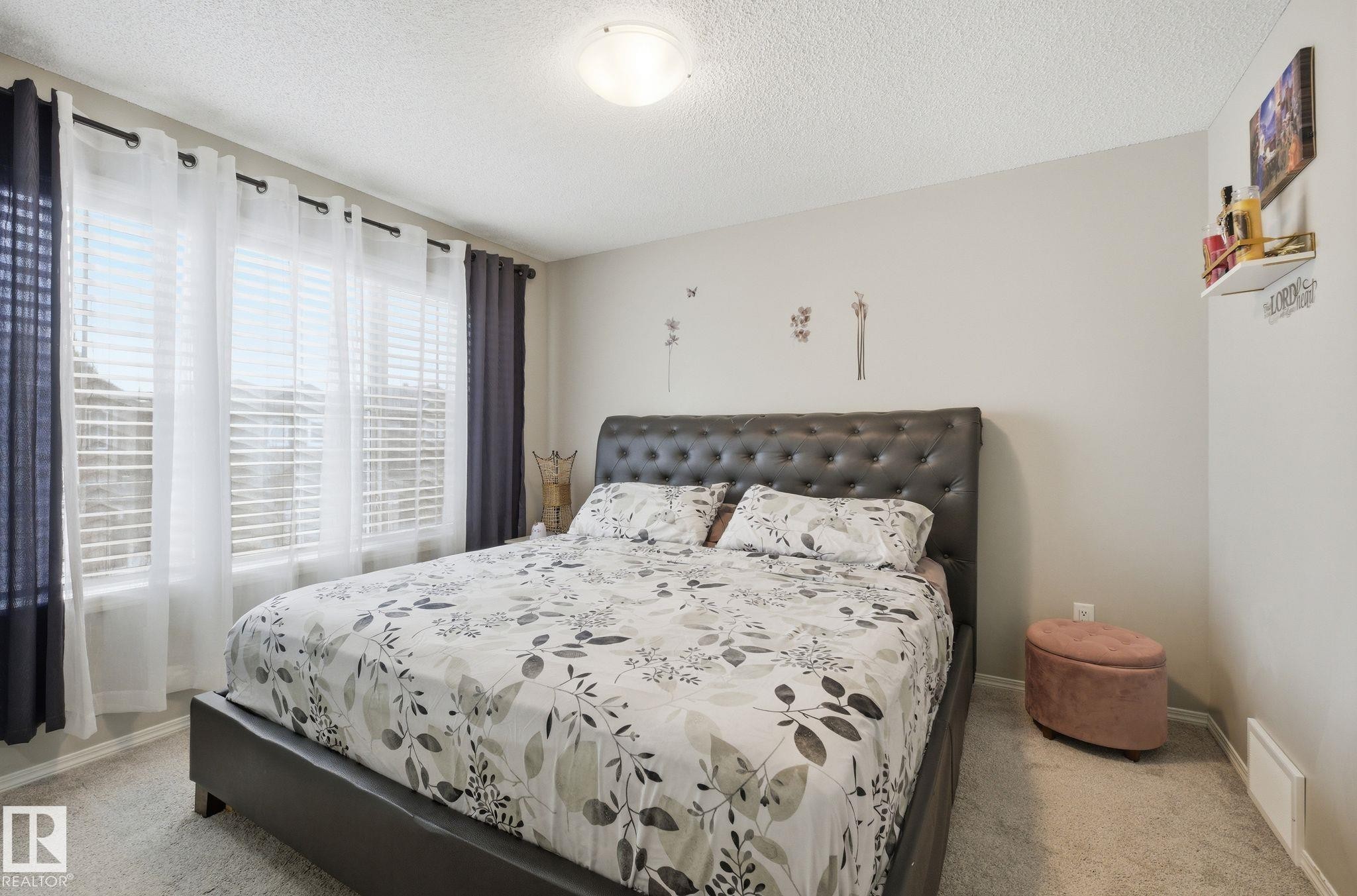 Bedroom featuring light-colored walls and carpet flooring - 4636 175 Ave, Edmonton, AB - Indoor Photo Showing Bedroom