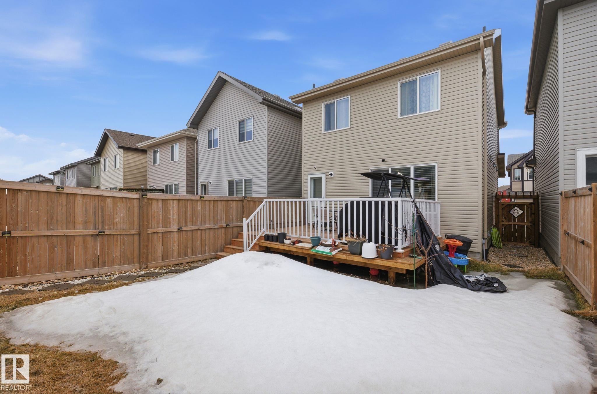 The property features a fenced yard with a deck and direct access to the interior - 4636 175 Ave, Edmonton, AB - Outdoor With Exterior