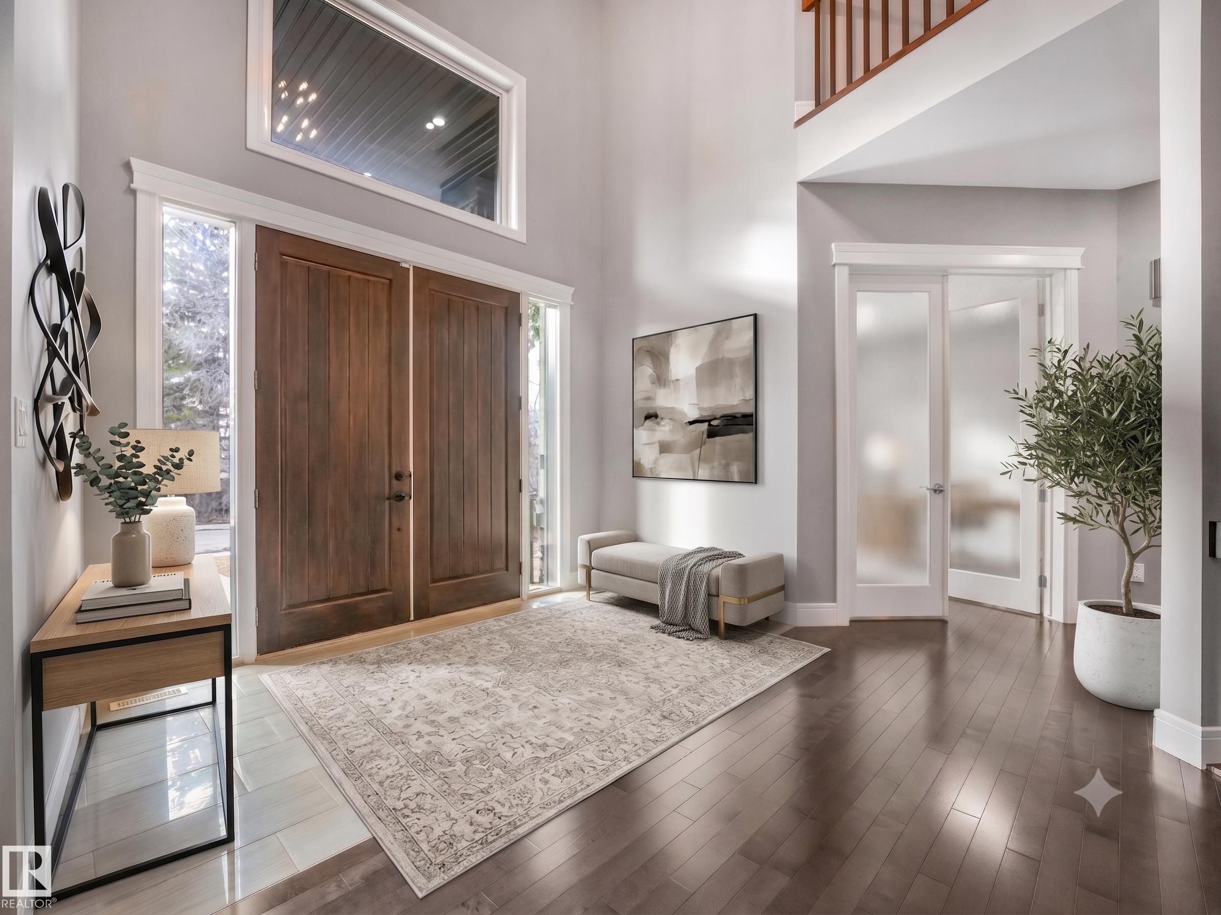 Grand entry featuring double wood doors with sidelights, a large transom window, high ceilings, dark wood-finish flooring, and a frosted glass French door - 8927 120 Street Nw, Edmonton, AB - Indoor Photo Showing Other Room
