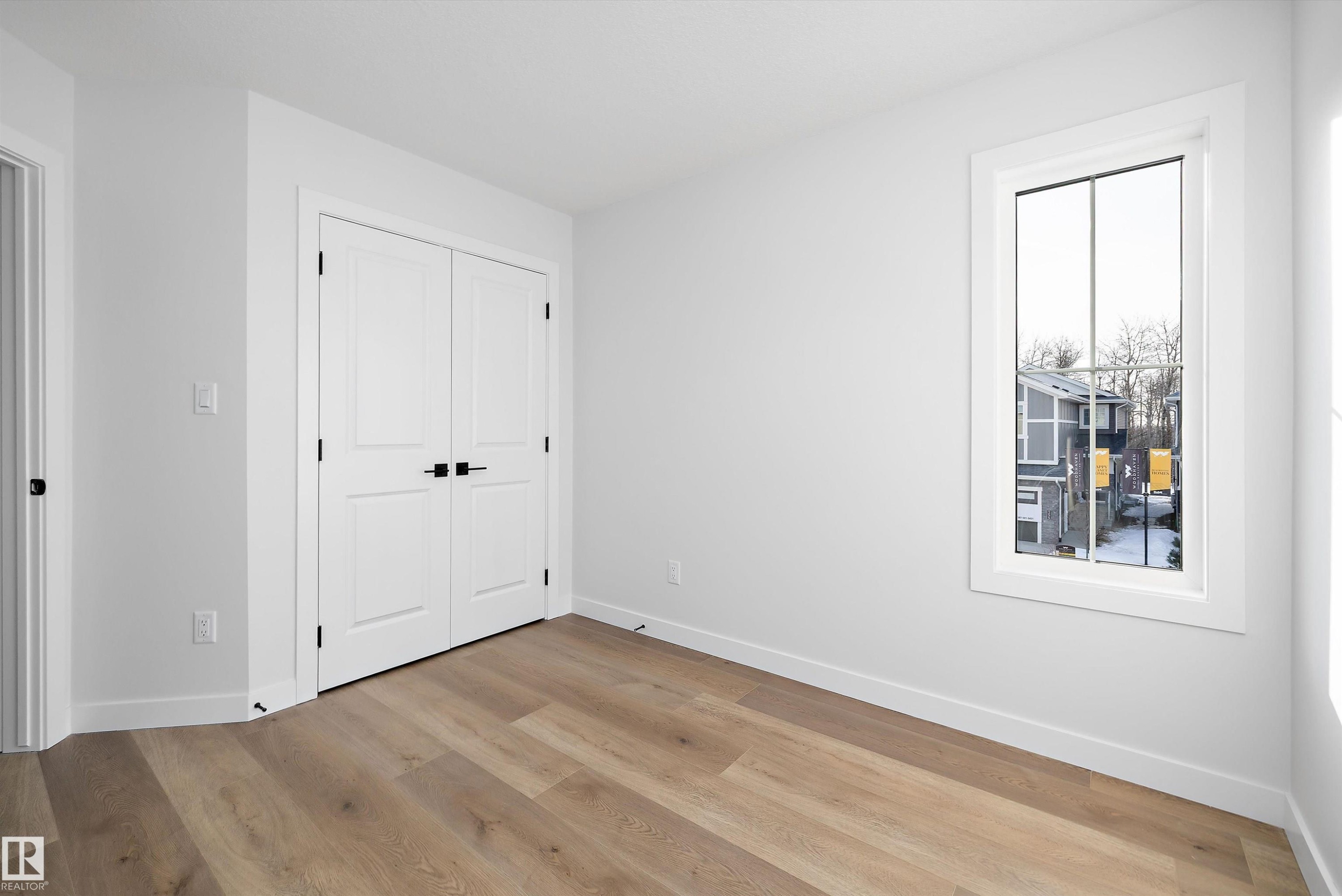 Bright interior space featuring light wood-finish flooring - 954 Elderberry Landing, Edmonton, AB - Indoor Photo Showing Other Room