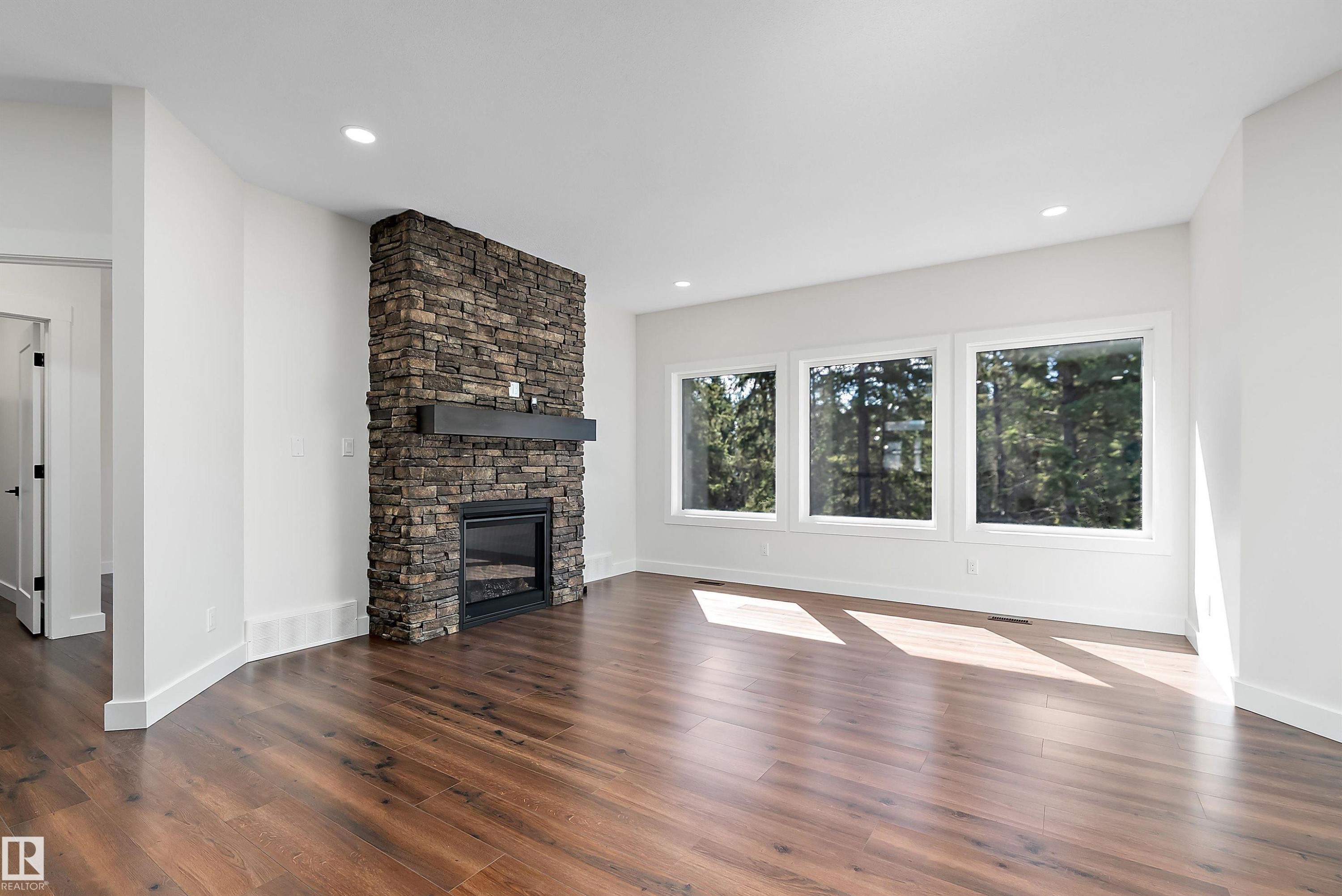 131 Bela Drive, Millet, AB - Indoor Photo Showing Living Room With Fireplace