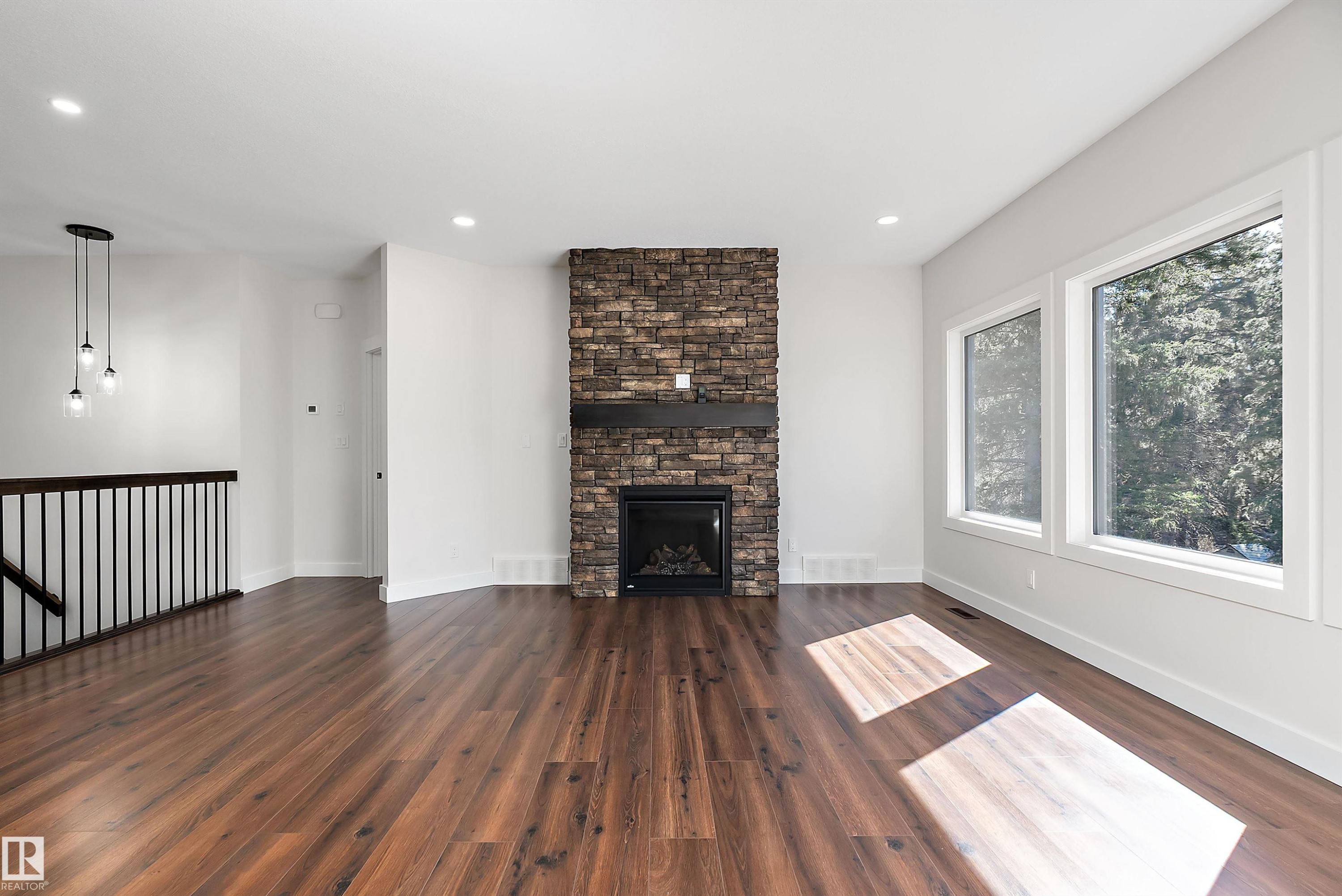 131 Bela Drive, Millet, AB - Indoor Photo Showing Living Room With Fireplace