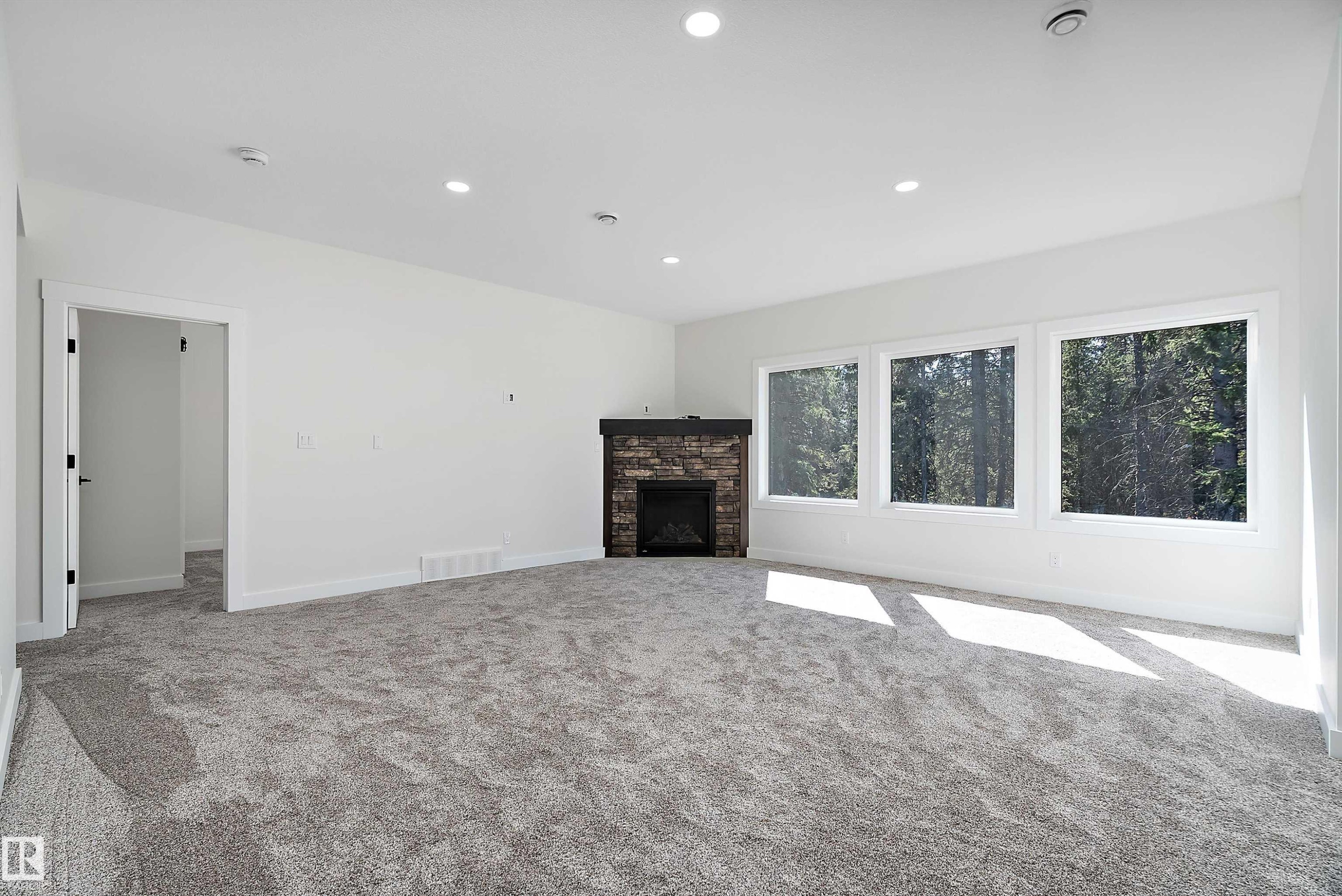 131 Bela Drive, Millet, AB - Indoor Photo Showing Other Room With Fireplace
