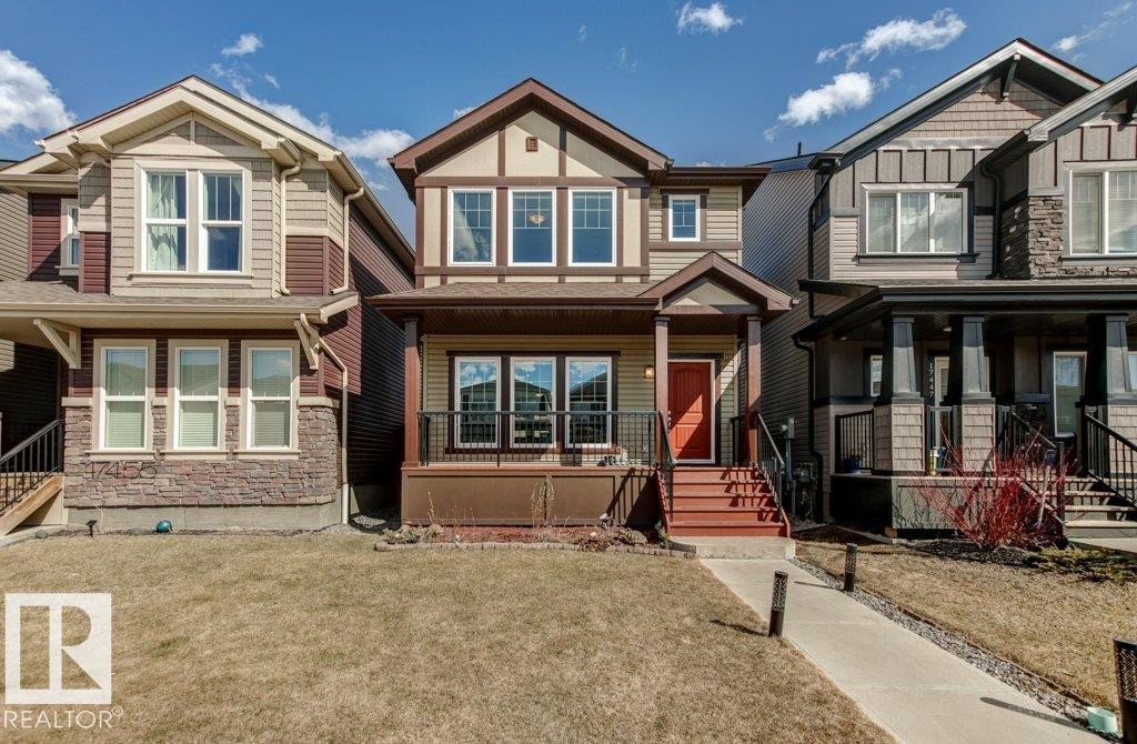 Contemporary detached residence featuring a multi-toned exterior with stone and siding accents - 17451 77 Street, Edmonton, AB - Outdoor With Facade