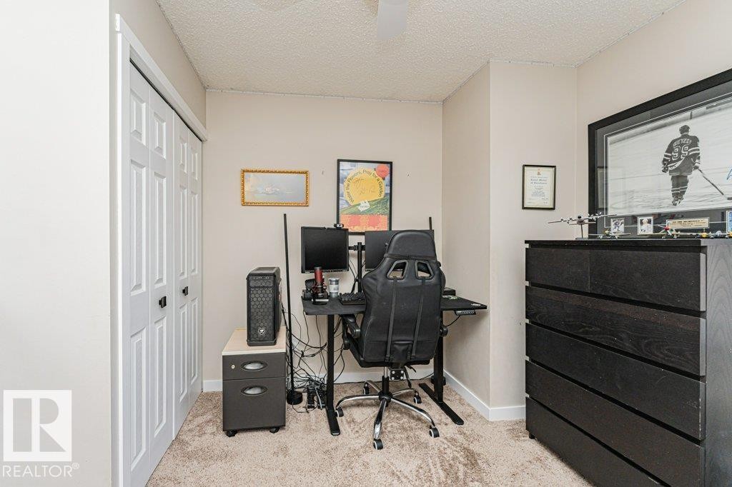 Neutral-toned room featuring a textured ceiling and light-colored walls - 1727 65 Street, Edmonton, AB - Indoor Photo Showing Office