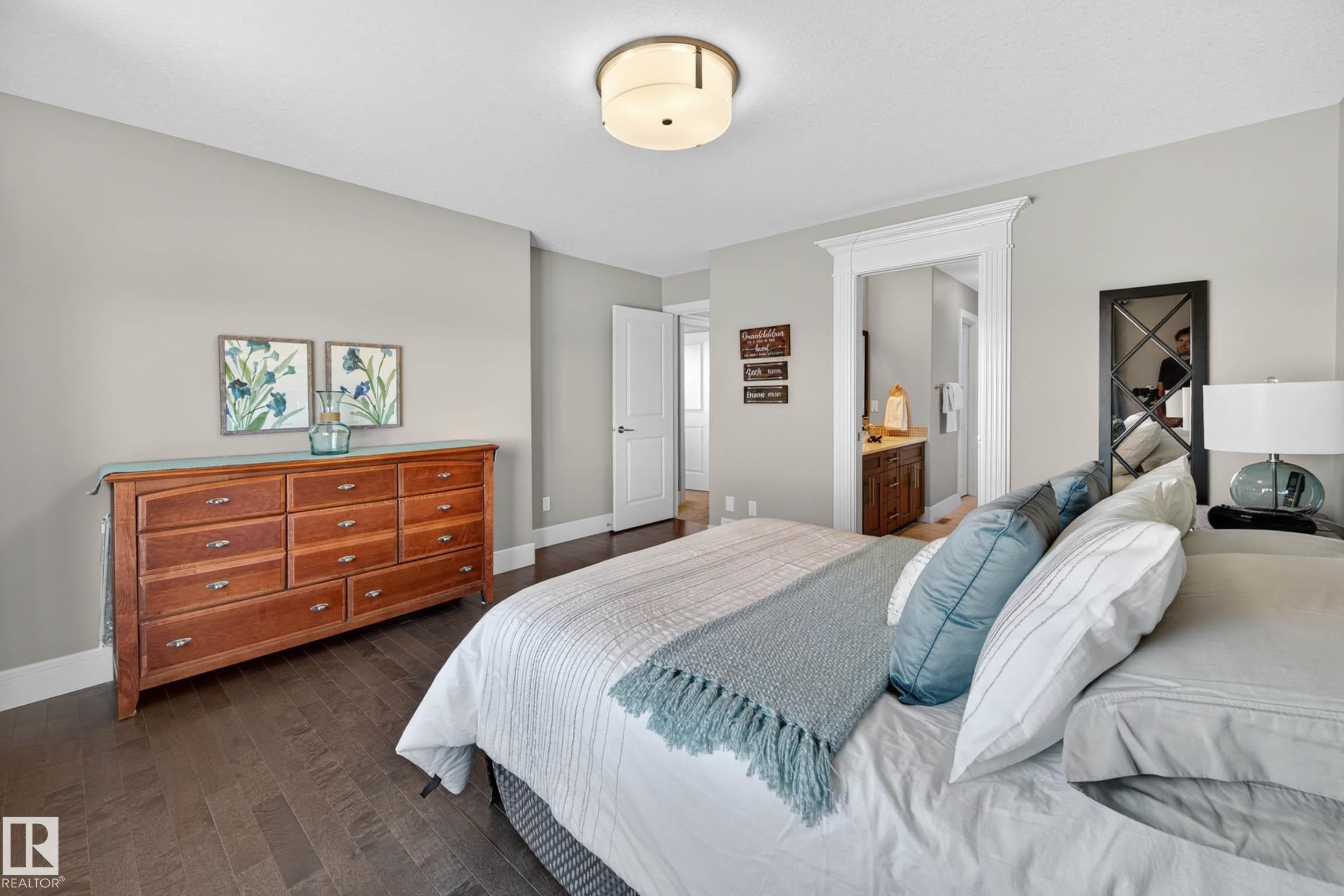 Bedroom featuring wood-finish flooring, light grey wall paint, and white trim - 2086 Redtail Common, Edmonton, AB - Indoor Photo Showing Bedroom