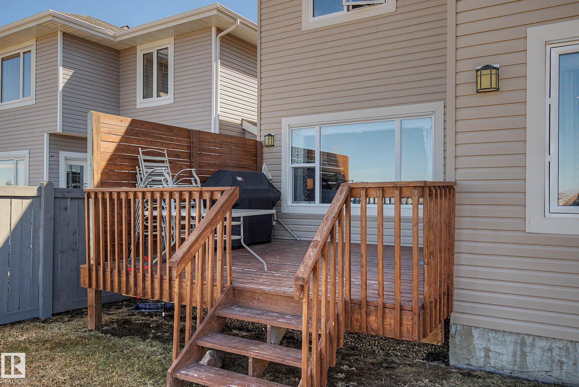 Exterior wood deck with railings and steps providing outdoor access - 2086 Redtail Common, Edmonton, AB - Outdoor With Deck Patio Veranda With Exterior
