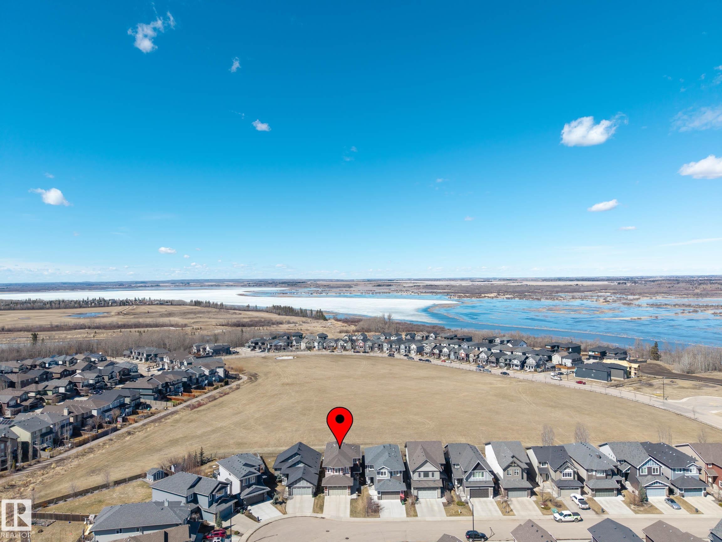 Aerial perspective showcasing residential properties with a water feature and surrounding natural landscape - 2086 Redtail Common, Edmonton, AB - Outdoor With View
