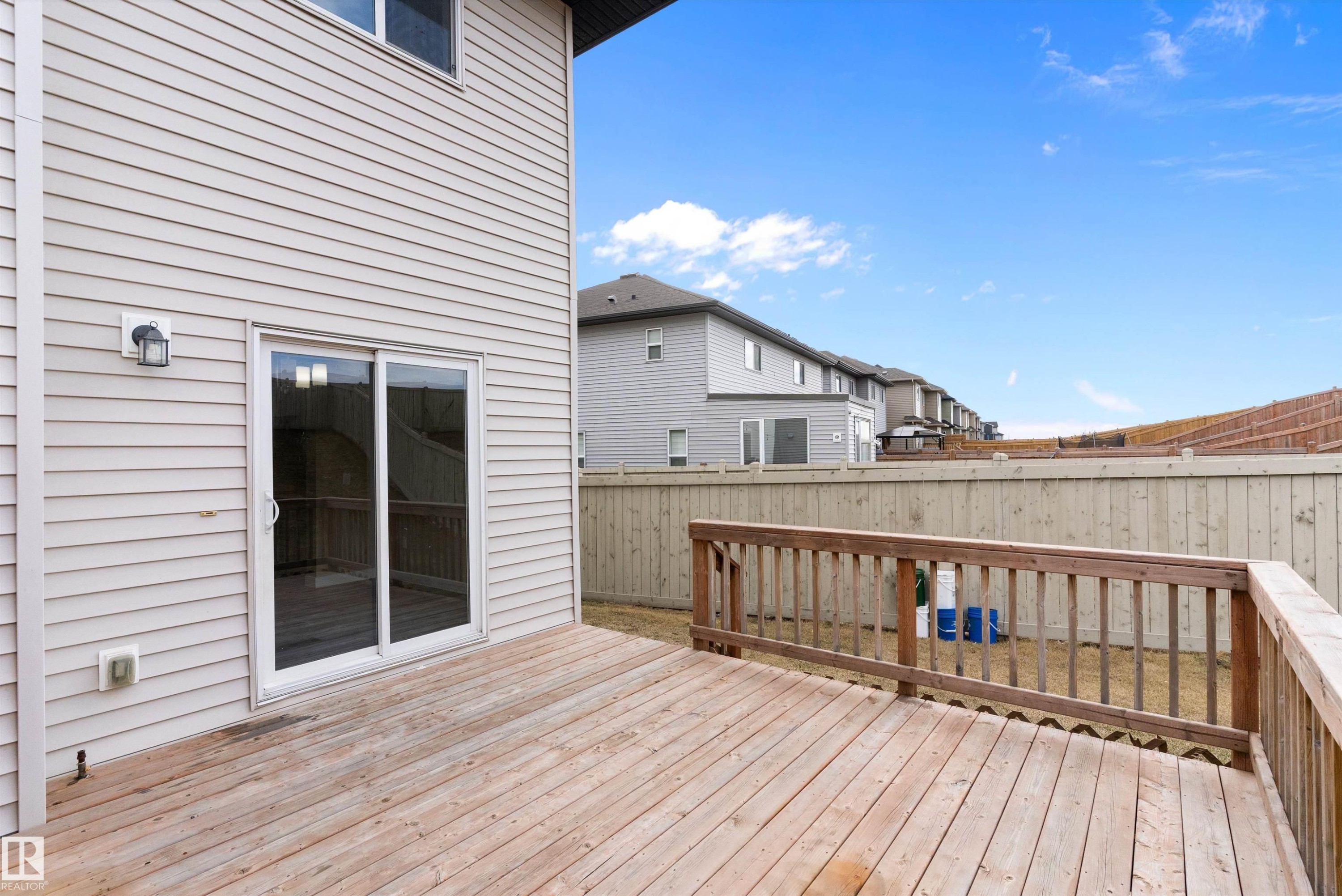 Spacious wood deck with a full wood railing - 3314 9 Street Nw, Edmonton, AB - Outdoor With Deck Patio Veranda With Exterior