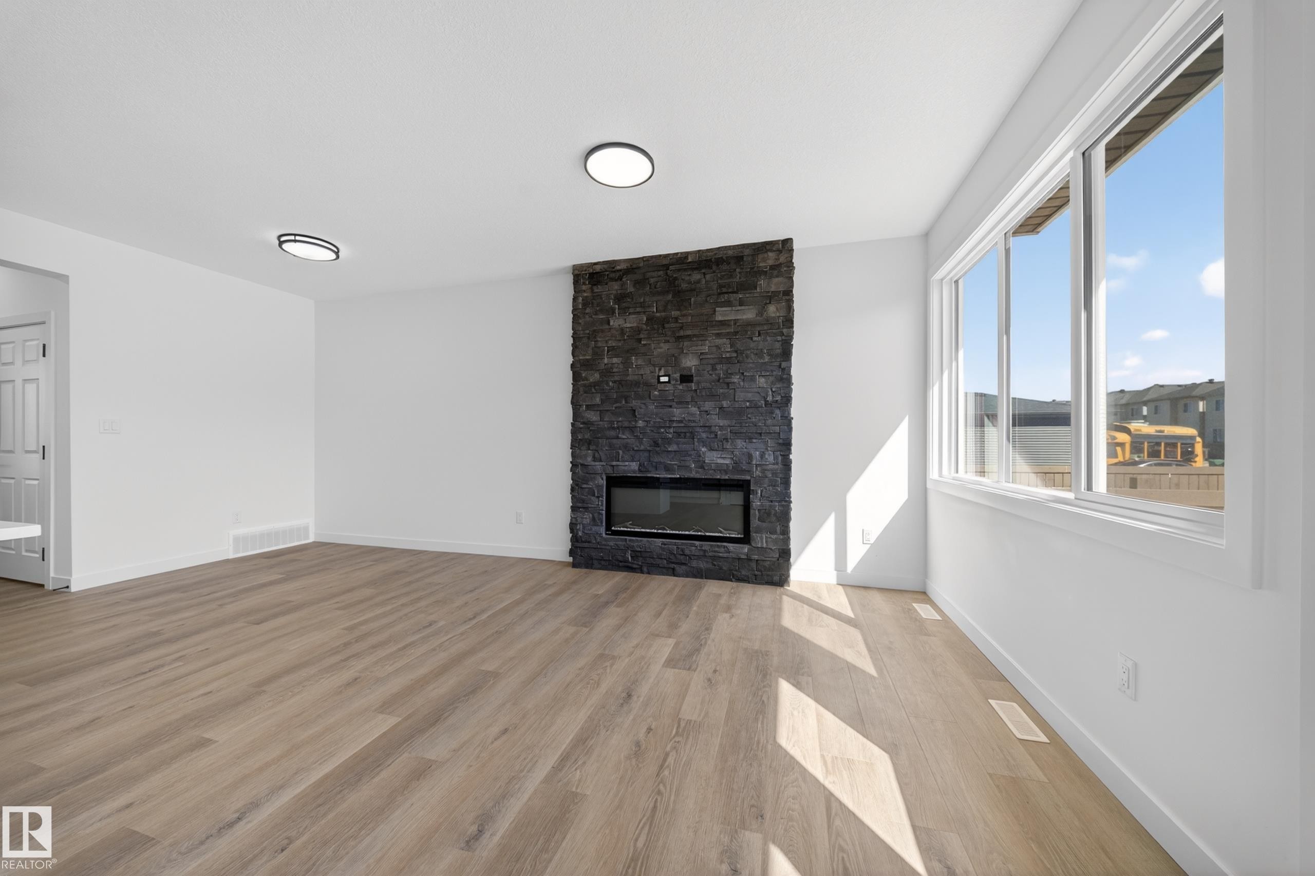 227 Deer Valley Drive, Leduc, AB - Indoor Photo Showing Living Room With Fireplace