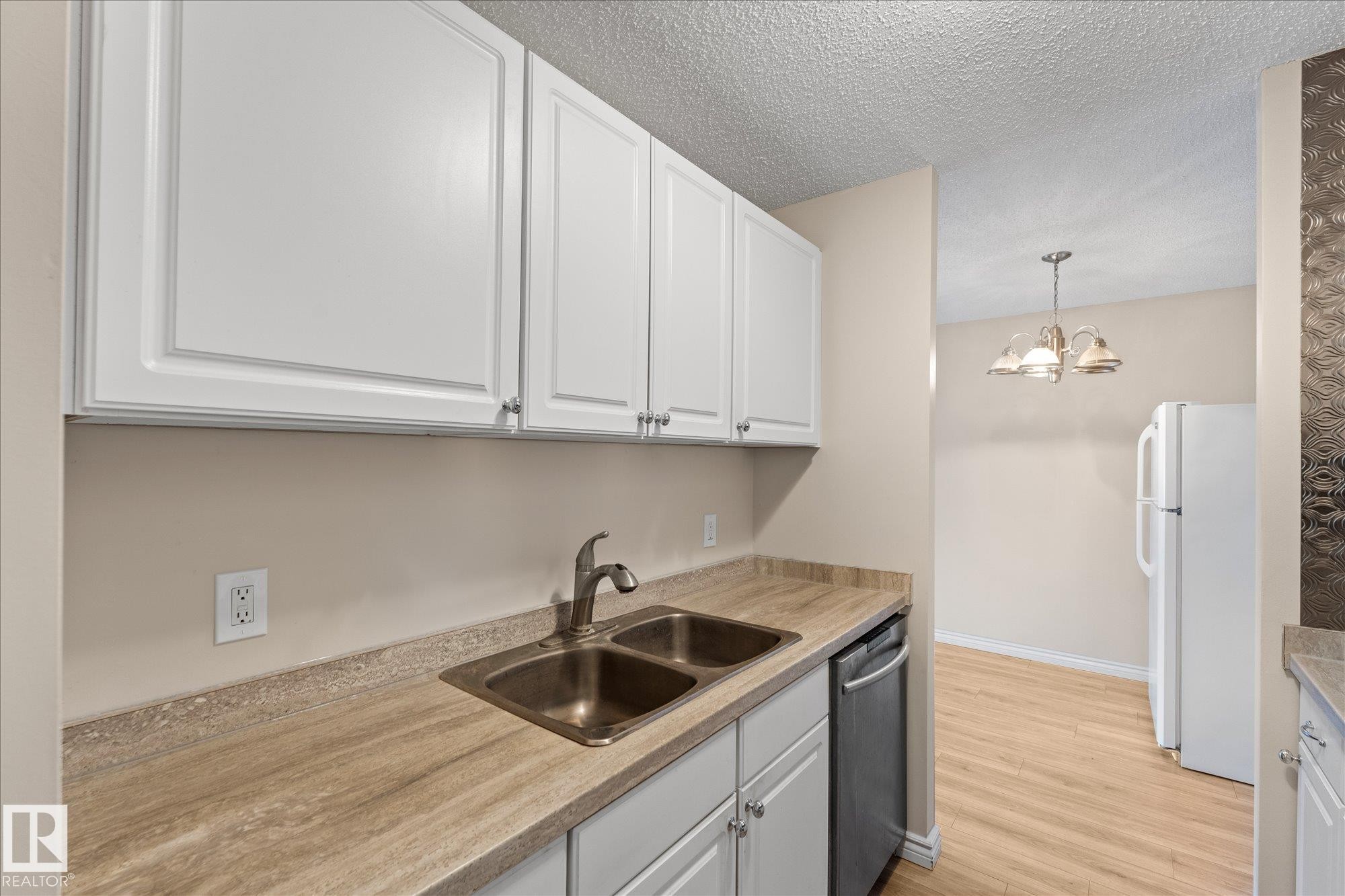 102 13910 Stony Plain Road, Edmonton, AB - Indoor Photo Showing Kitchen With Double Sink