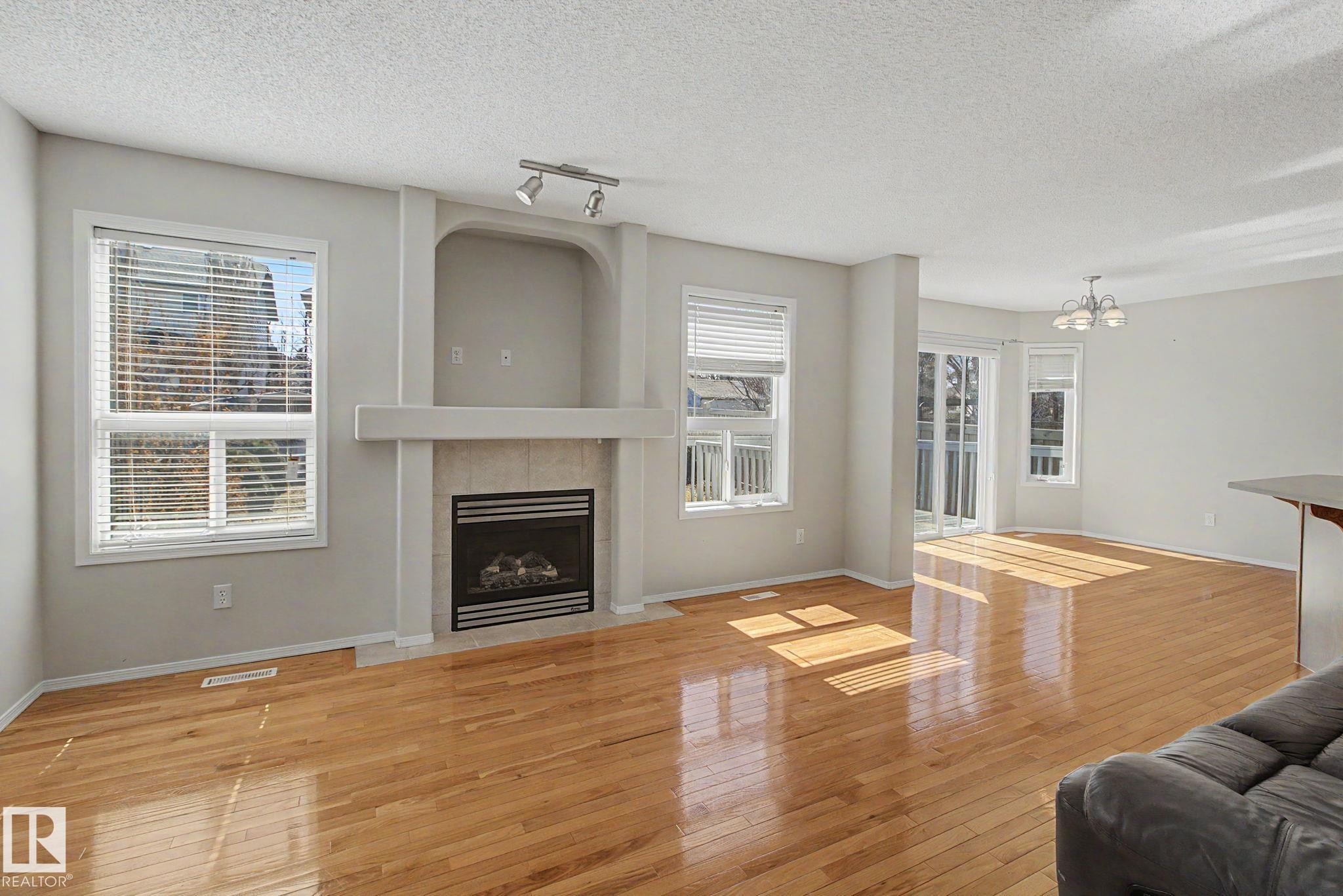3505 Mclean Crescent, Edmonton, AB - Indoor Photo Showing Living Room With Fireplace