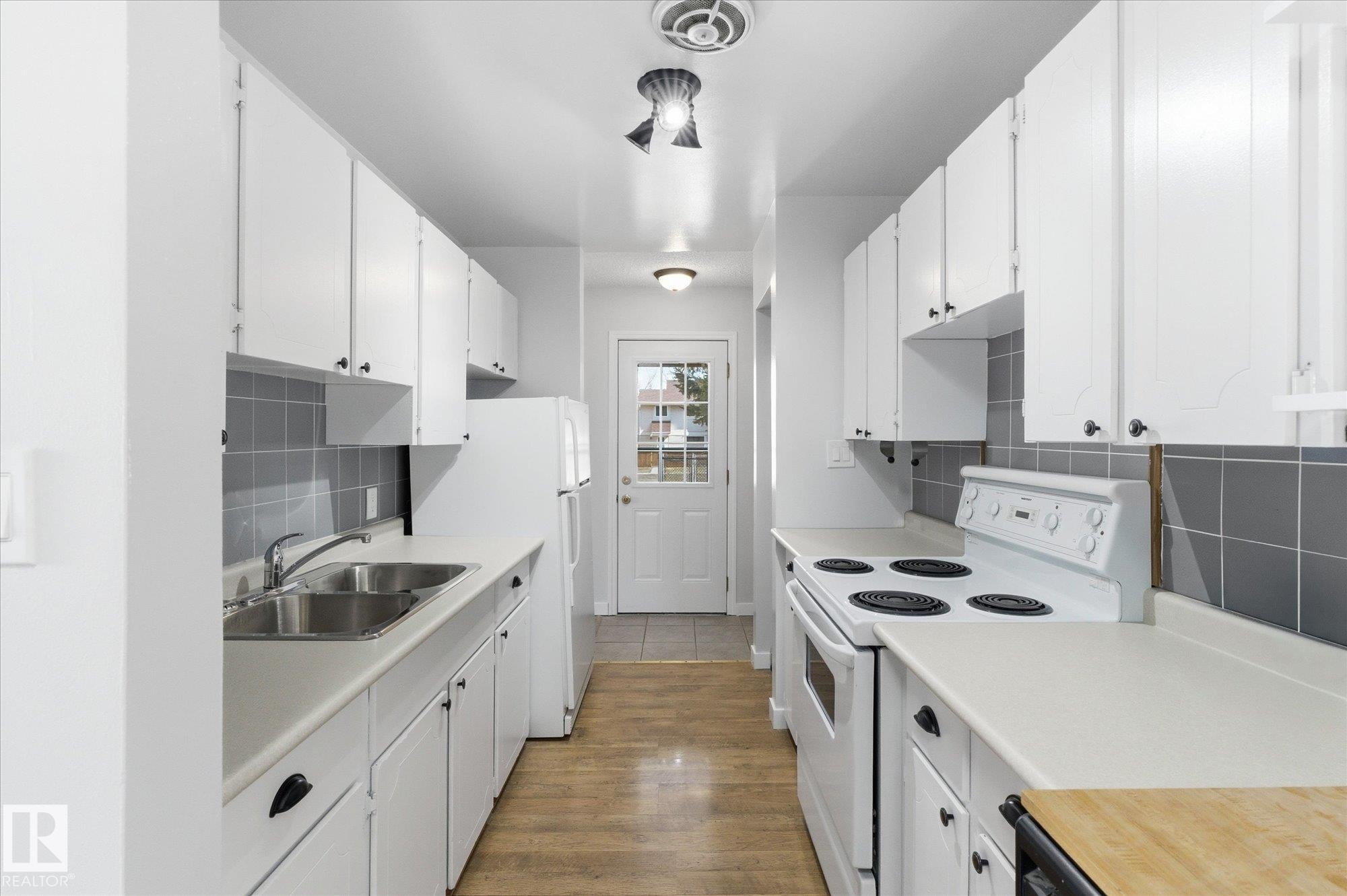 20 Athabasca Acres, Devon, AB - Indoor Photo Showing Kitchen With Double Sink