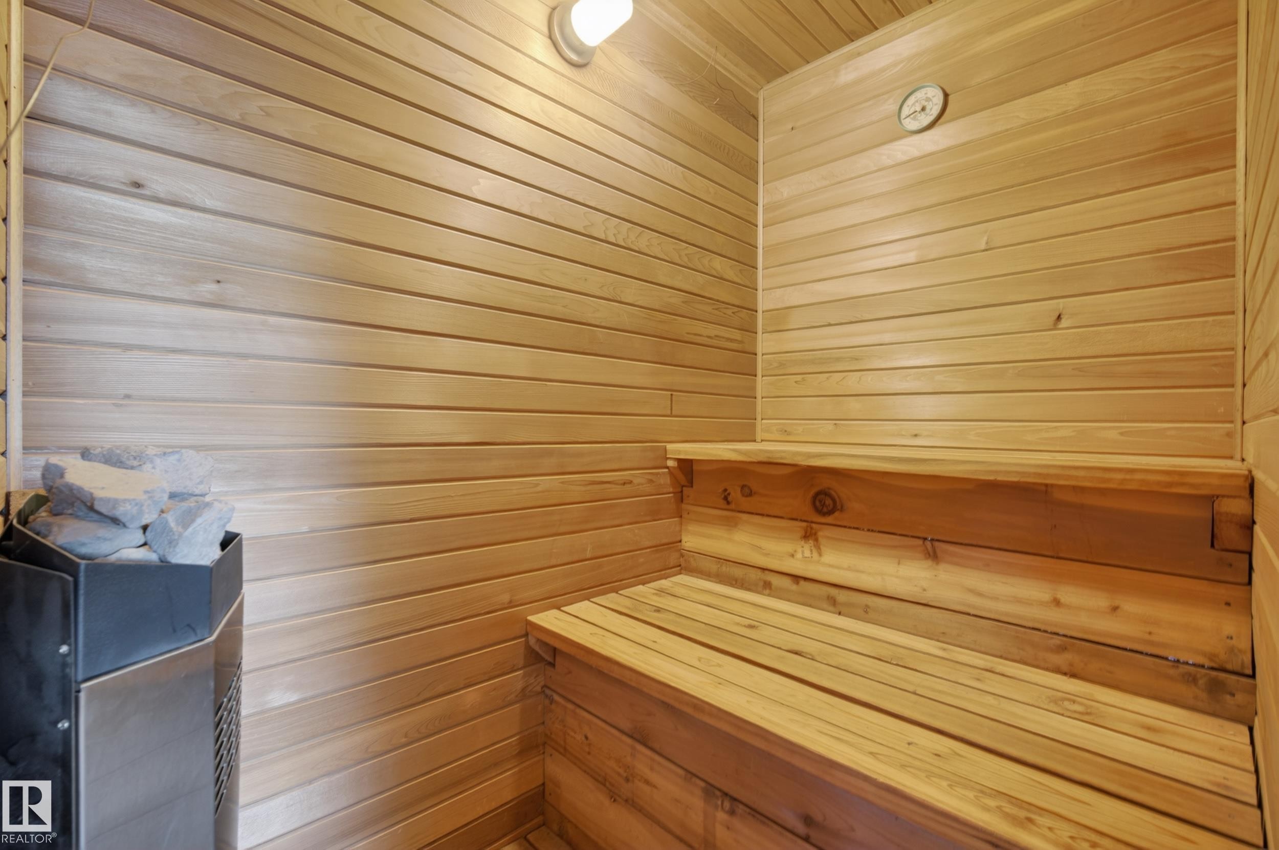 Dedicated sauna featuring wood-paneled walls and tiered wooden benches - 33 Glen Meadow Crescent, St. Albert, AB - Indoor Photo Showing Other Room