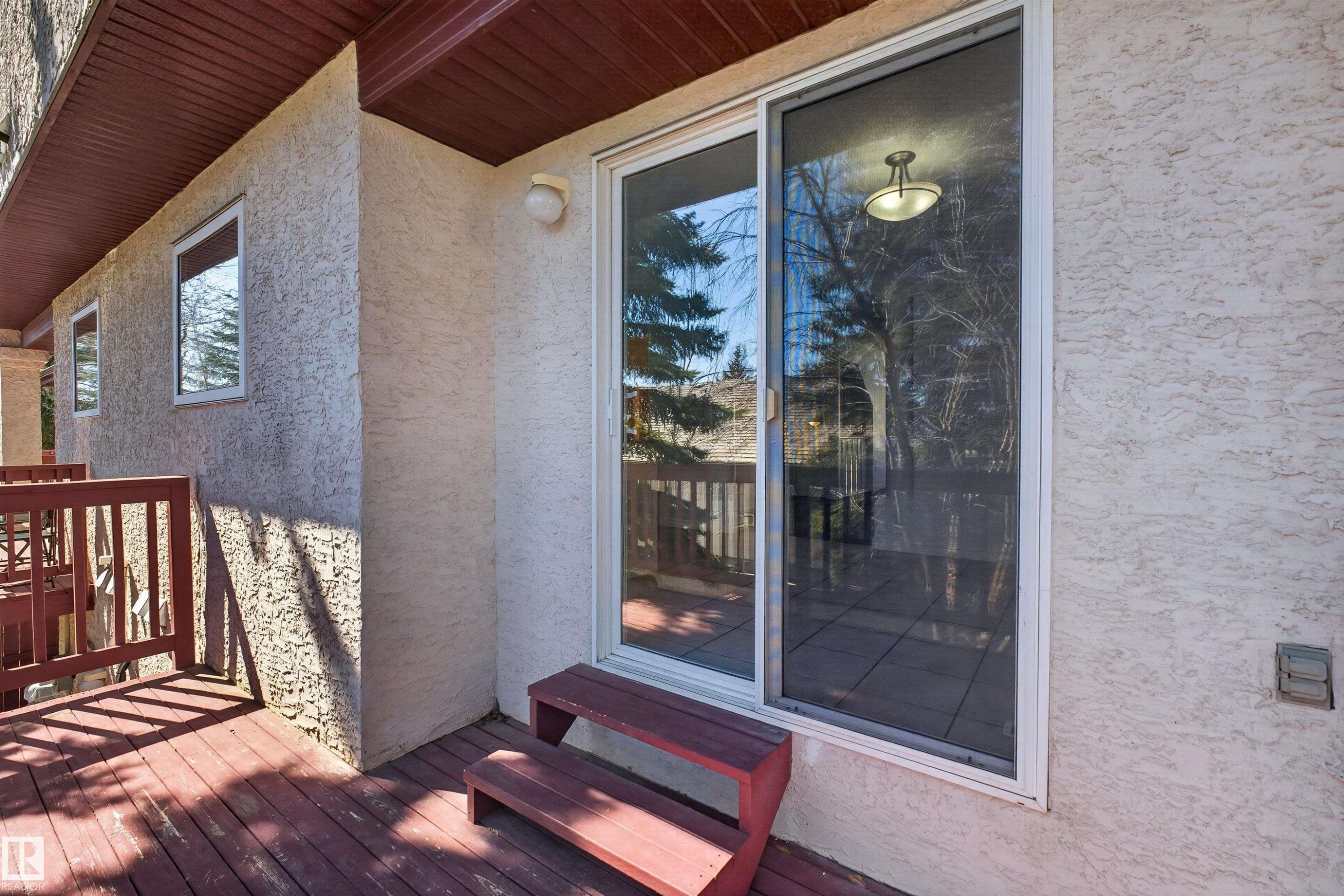 Spacious exterior deck with wood-finish flooring and matching railings - 6 1237 Carter Crest Road, Edmonton, AB