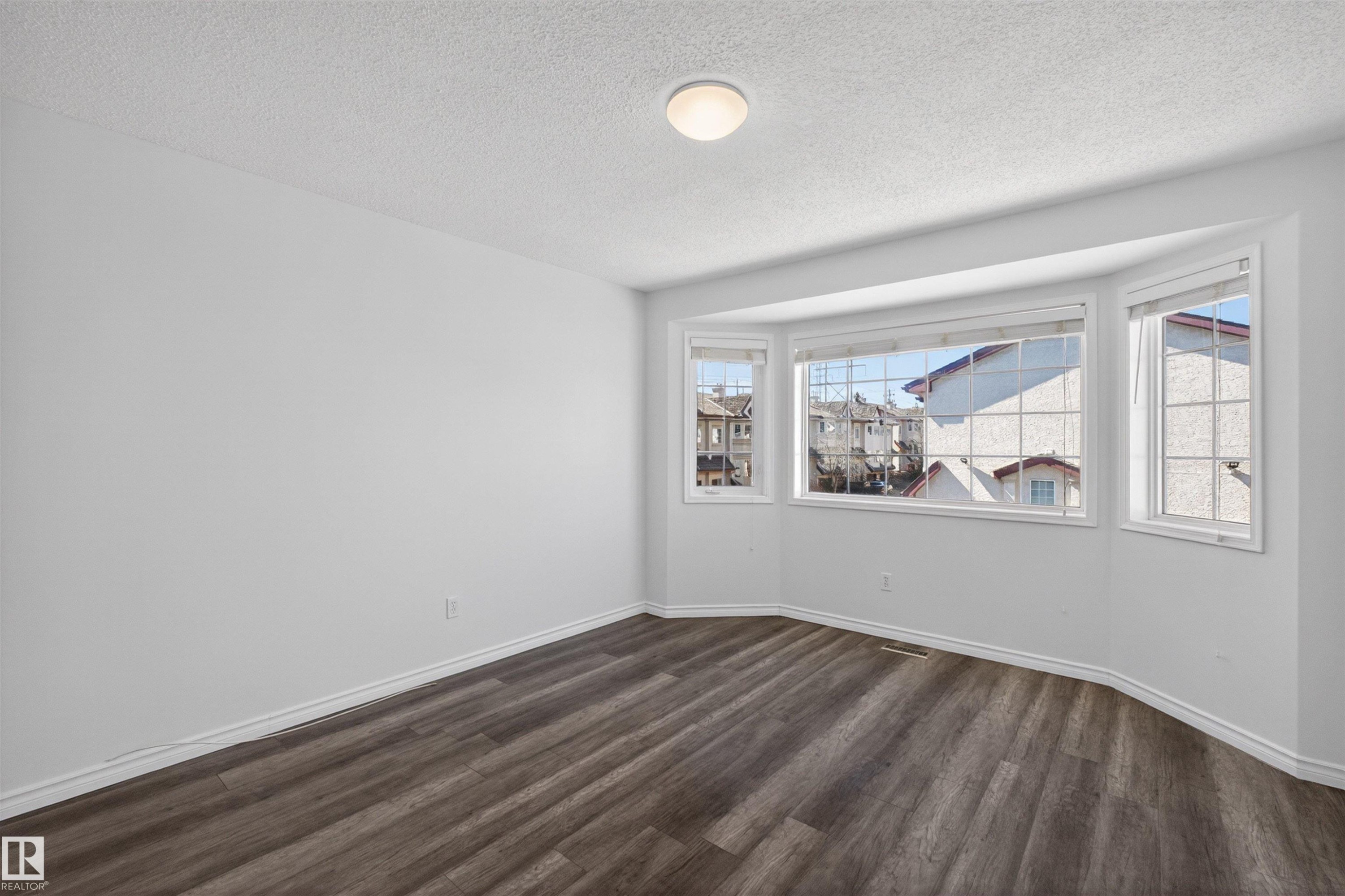 Expansive bay window featuring white trim and multiple panes - 6 1237 Carter Crest Road, Edmonton, AB