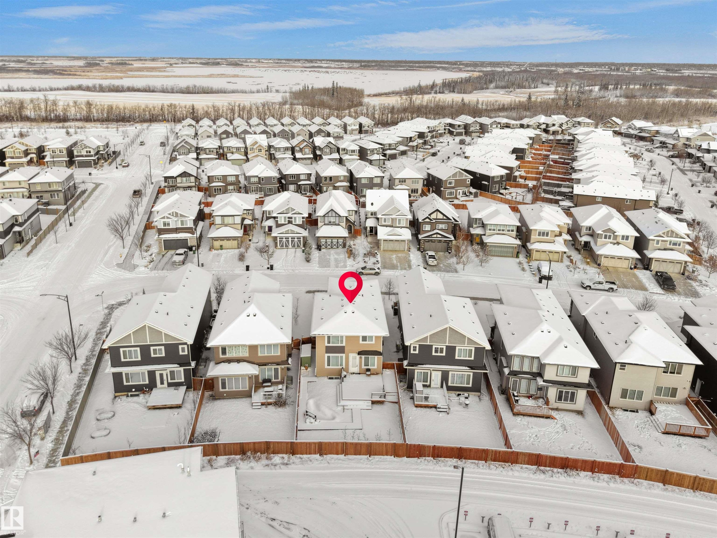 Two-story residence featuring a neutral-toned exterior, gabled roofline, and attached garage - 20827 130 Avenue Nw, Edmonton, AB - Outdoor With View