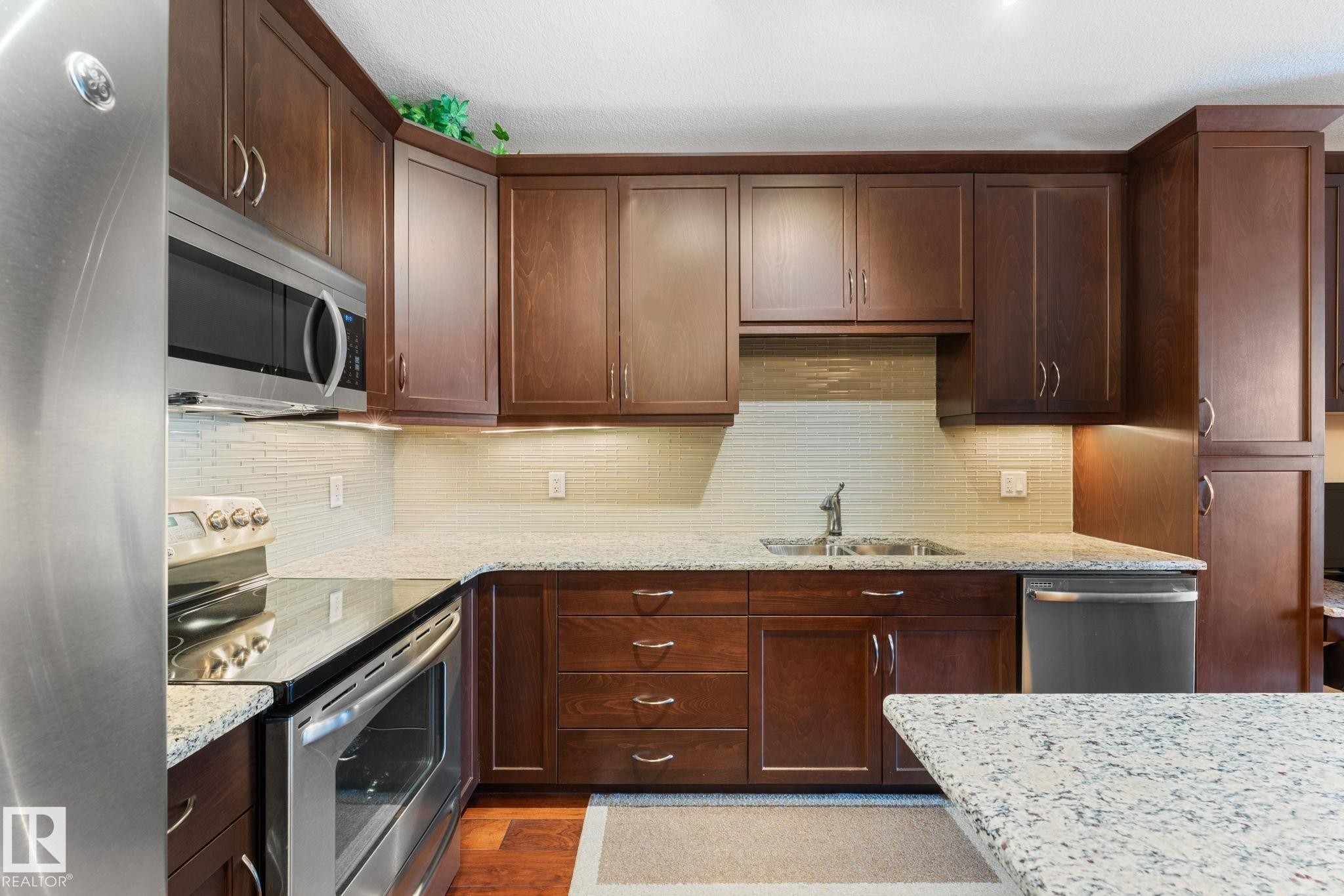 251 6079 Maynard Way, Edmonton, AB - Indoor Photo Showing Kitchen With Stainless Steel Kitchen With Double Sink With Upgraded Kitchen