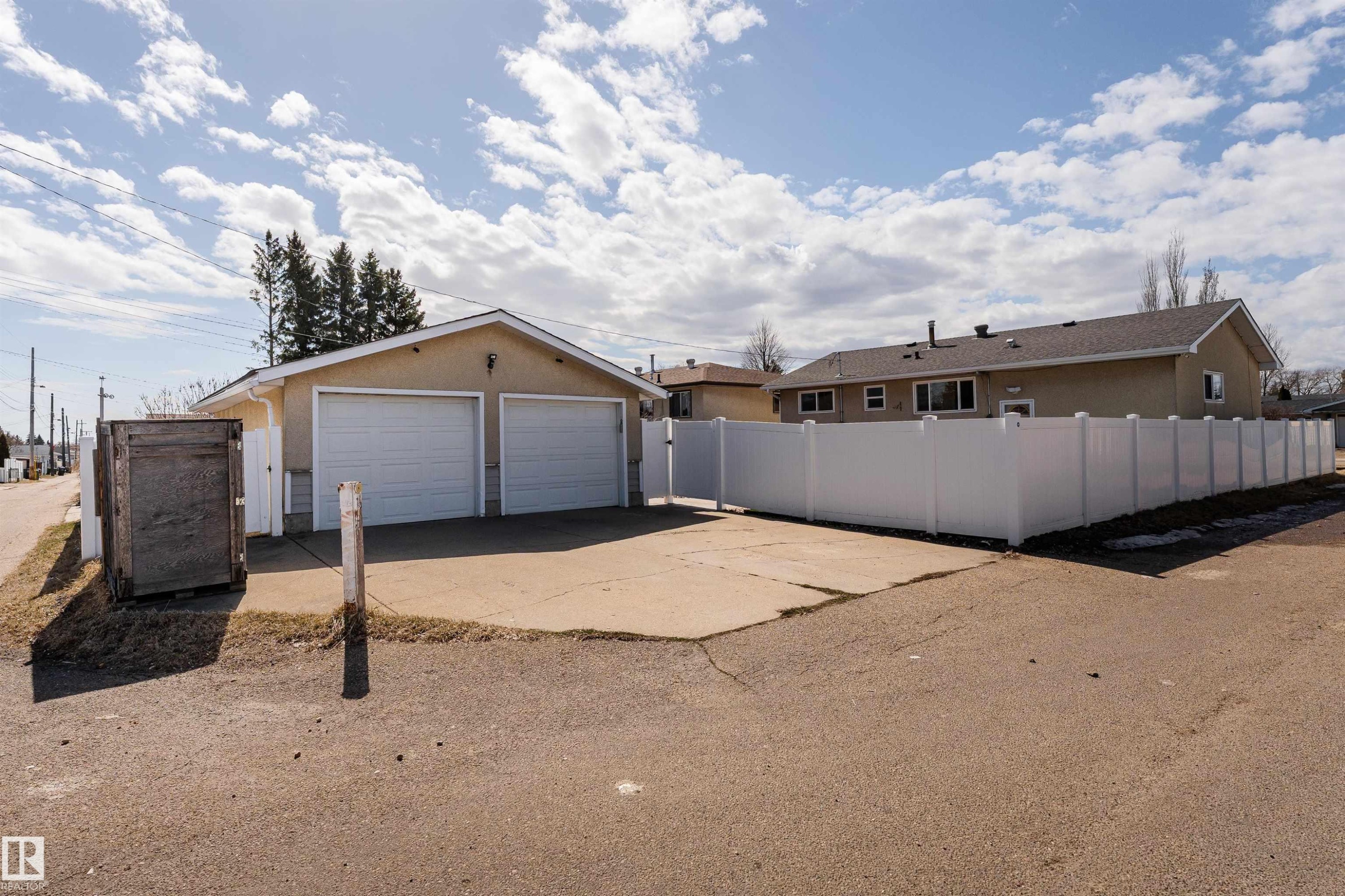 Two-car detached garage with concrete driveway and stucco exterior - 13331 64 Street Nw, Edmonton, AB - Outdoor
