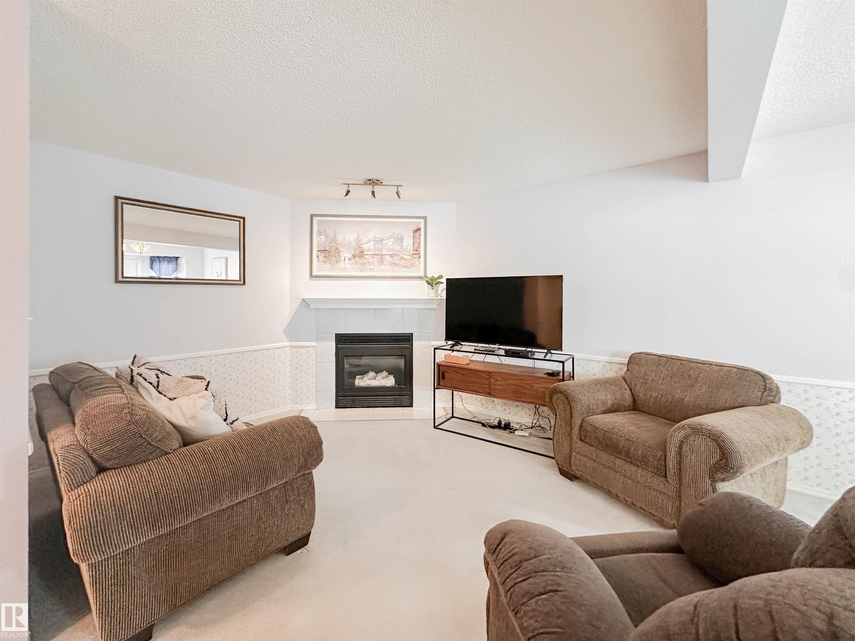 3 10 Devon Close, St. Albert, AB - Indoor Photo Showing Living Room With Fireplace