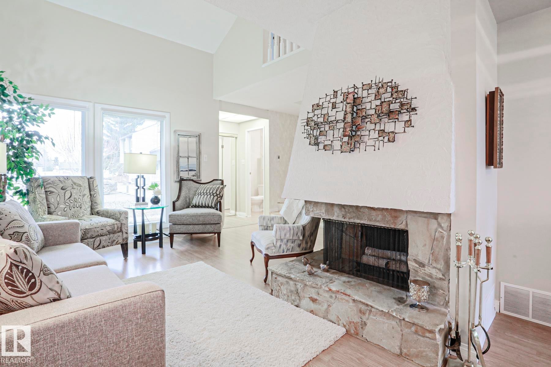 12 2020 105 Street, Edmonton, AB - Indoor Photo Showing Living Room With Fireplace
