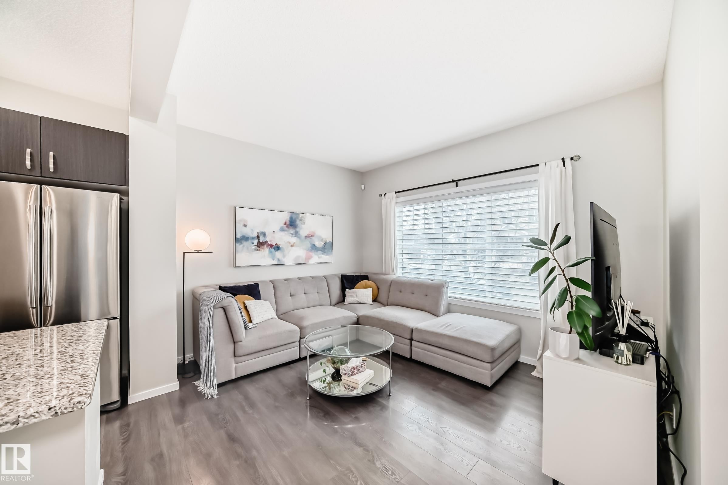 Open-concept living space with wood-finish flooring - 3278 Cherry Crescent, Edmonton, AB - Indoor Photo Showing Living Room