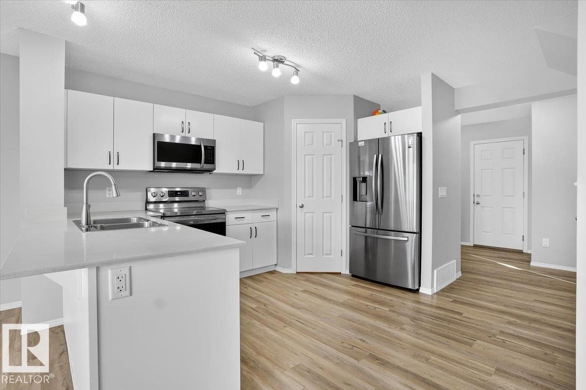9046 Cooper Link, Edmonton, AB - Indoor Photo Showing Kitchen With Stainless Steel Kitchen With Double Sink With Upgraded Kitchen