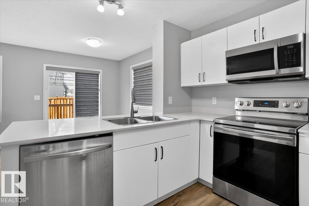 9046 Cooper Link, Edmonton, AB - Indoor Photo Showing Kitchen With Double Sink