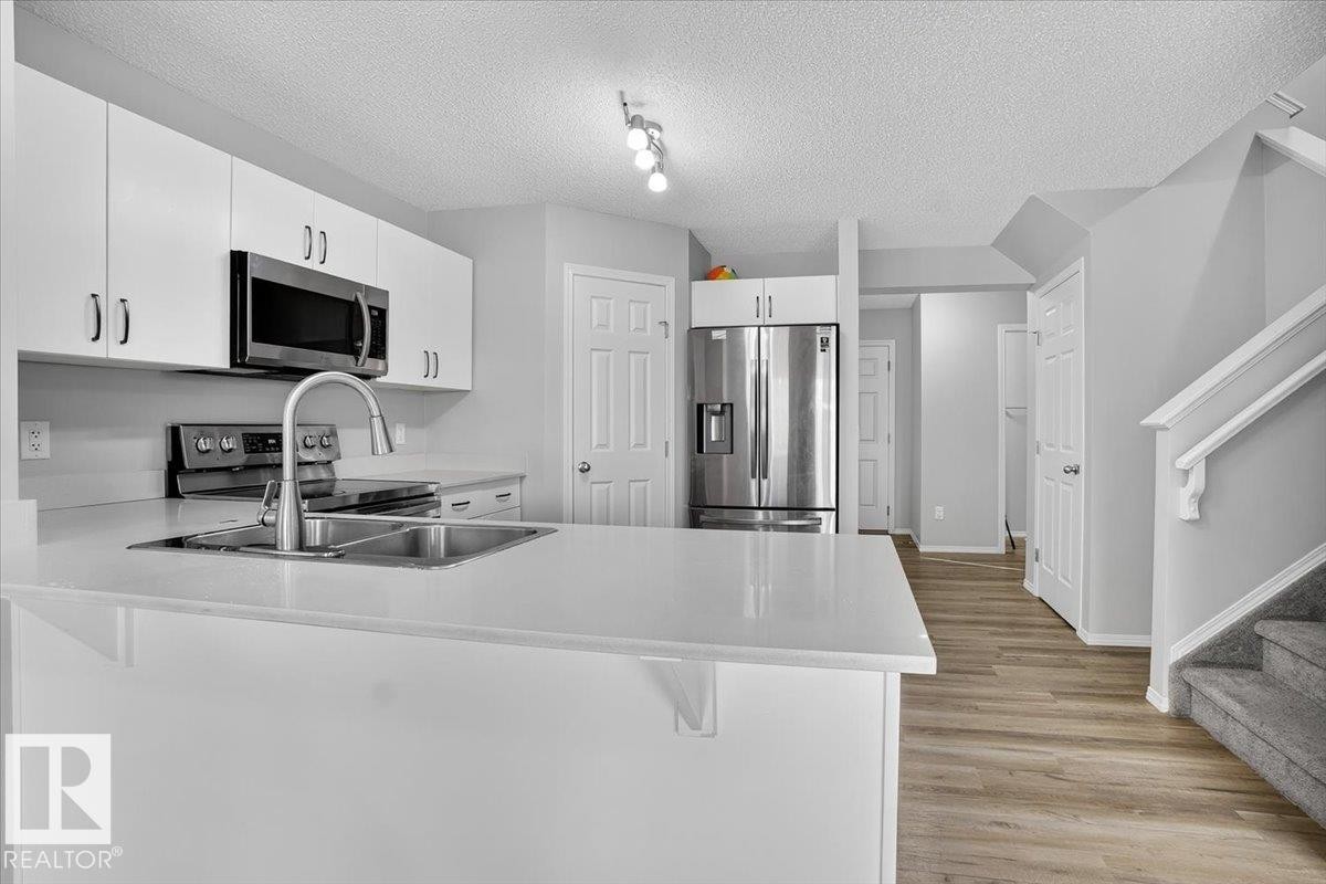 9046 Cooper Link, Edmonton, AB - Indoor Photo Showing Kitchen With Stainless Steel Kitchen With Double Sink
