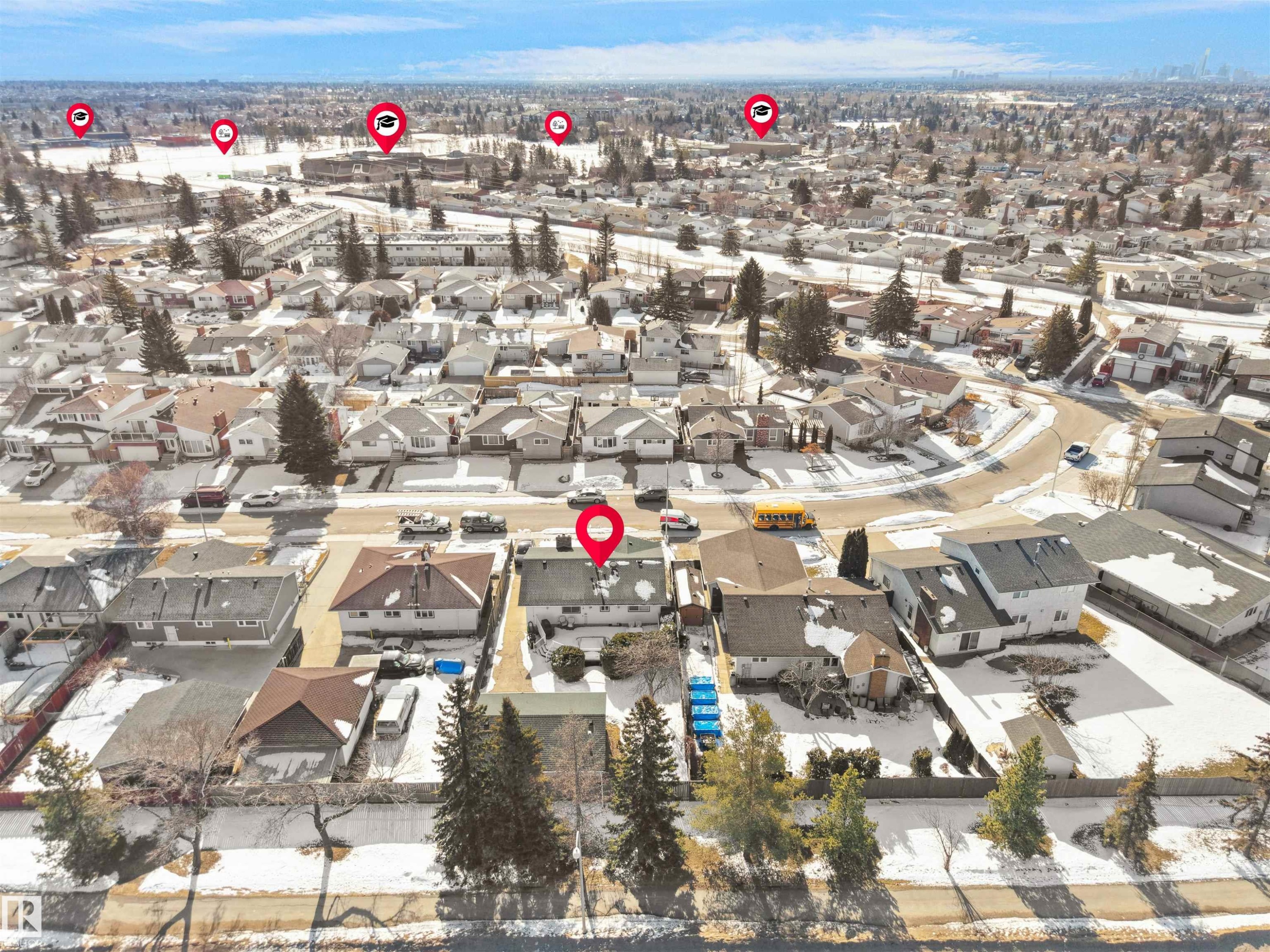 Aerial perspective showcasing a residential neighborhood with numerous detached homes, surrounded by trees and open spaces - 11044 166 Avenue, Edmonton, AB - Outdoor With View