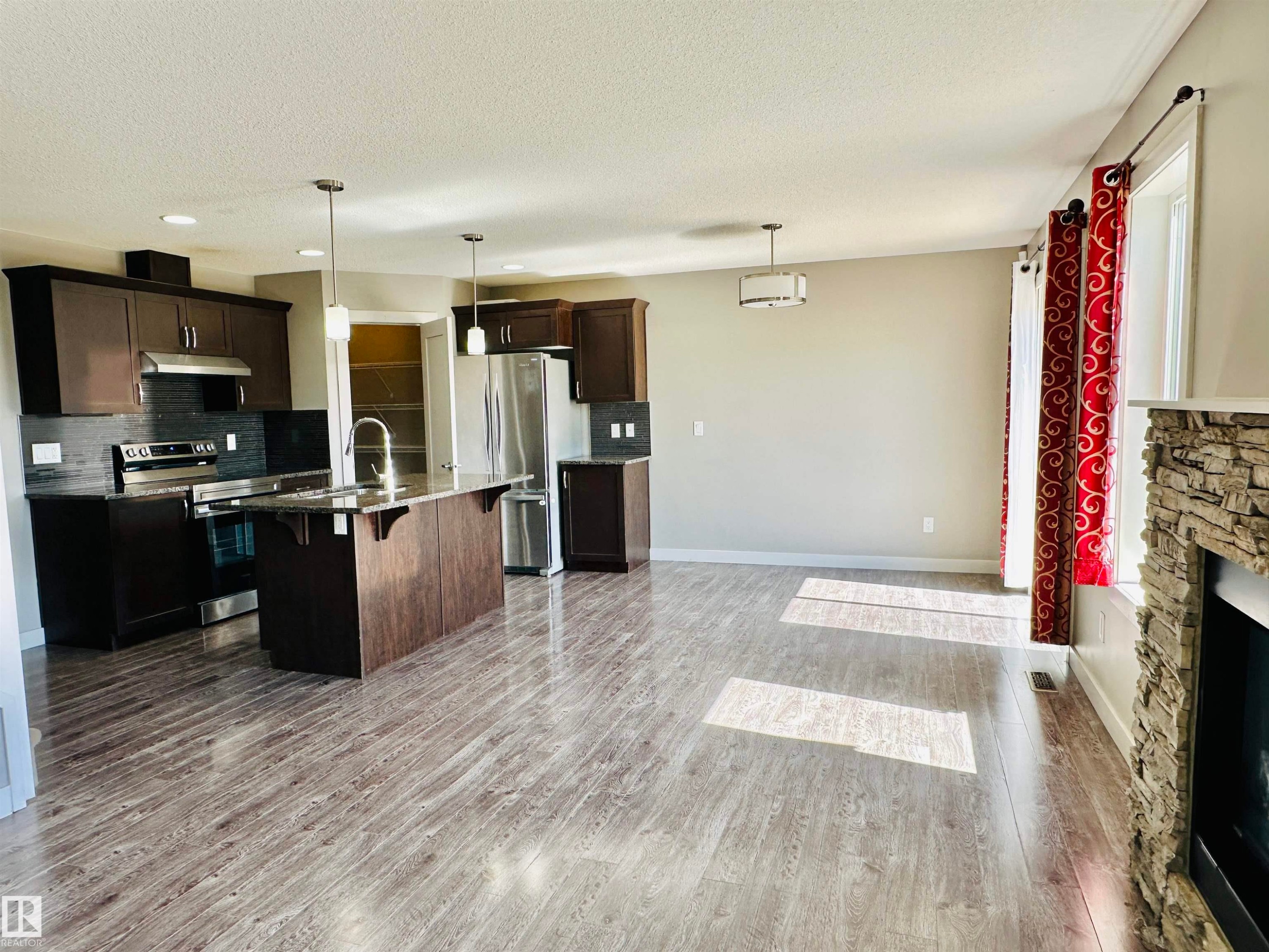 1655 Hammond Crescent, Edmonton, AB - Indoor Photo Showing Kitchen With Fireplace With Double Sink