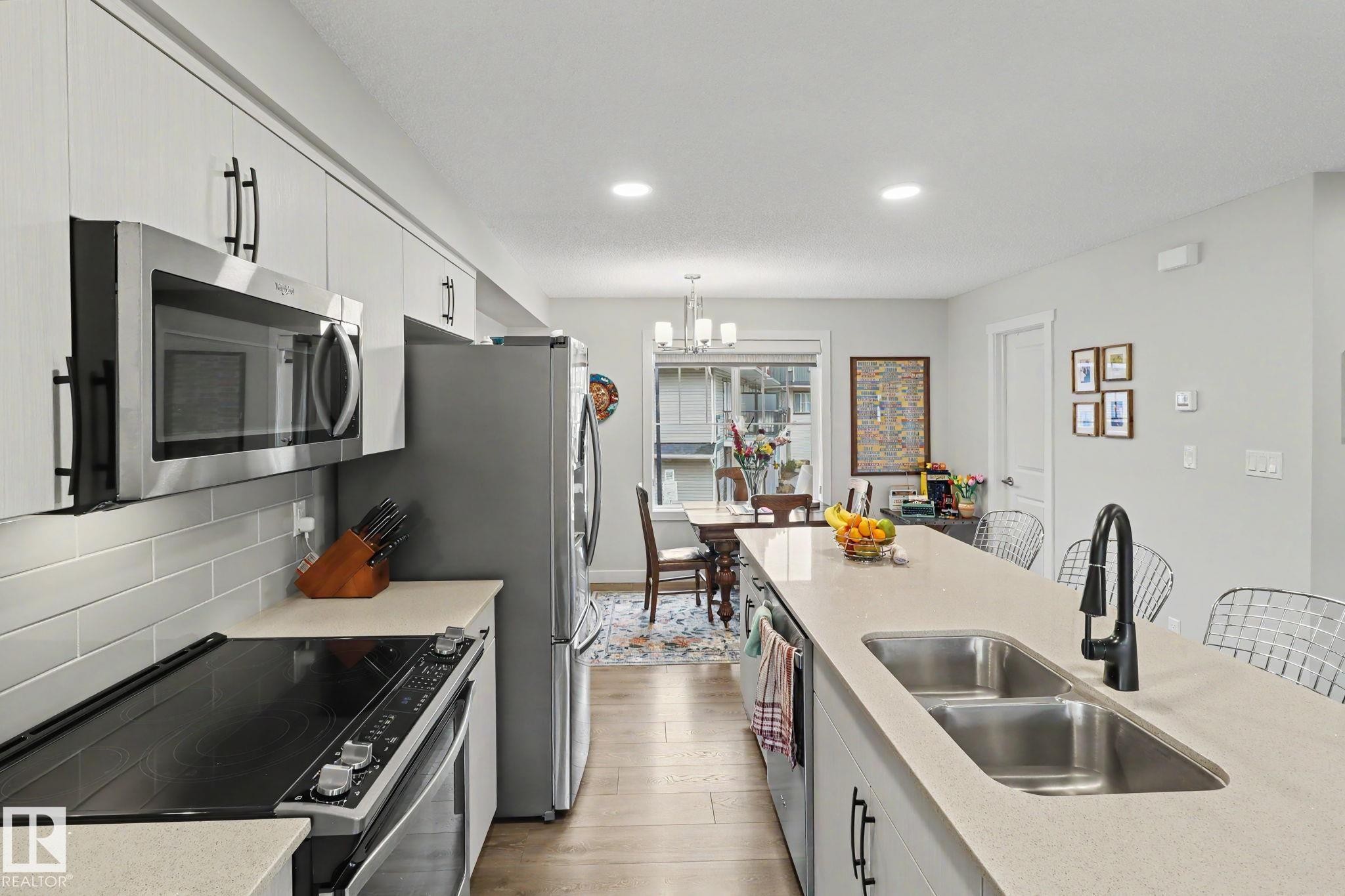 24 165 Cy Becker Blvd, Edmonton, AB - Indoor Photo Showing Kitchen With Double Sink