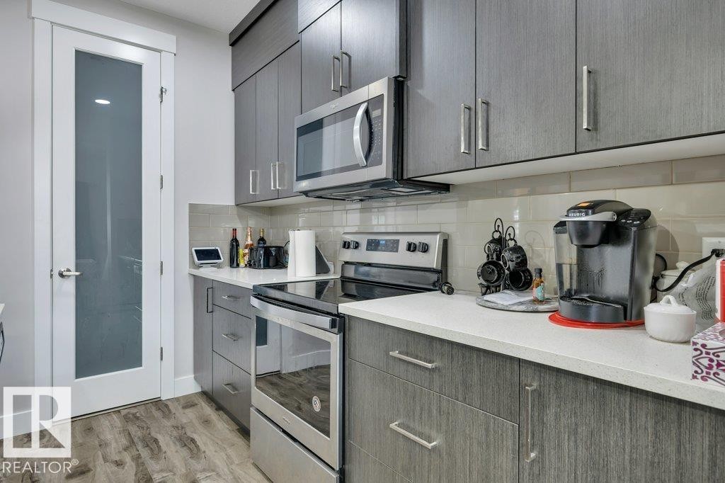 100 Aston Bend, Leduc, AB - Indoor Photo Showing Kitchen With Upgraded Kitchen