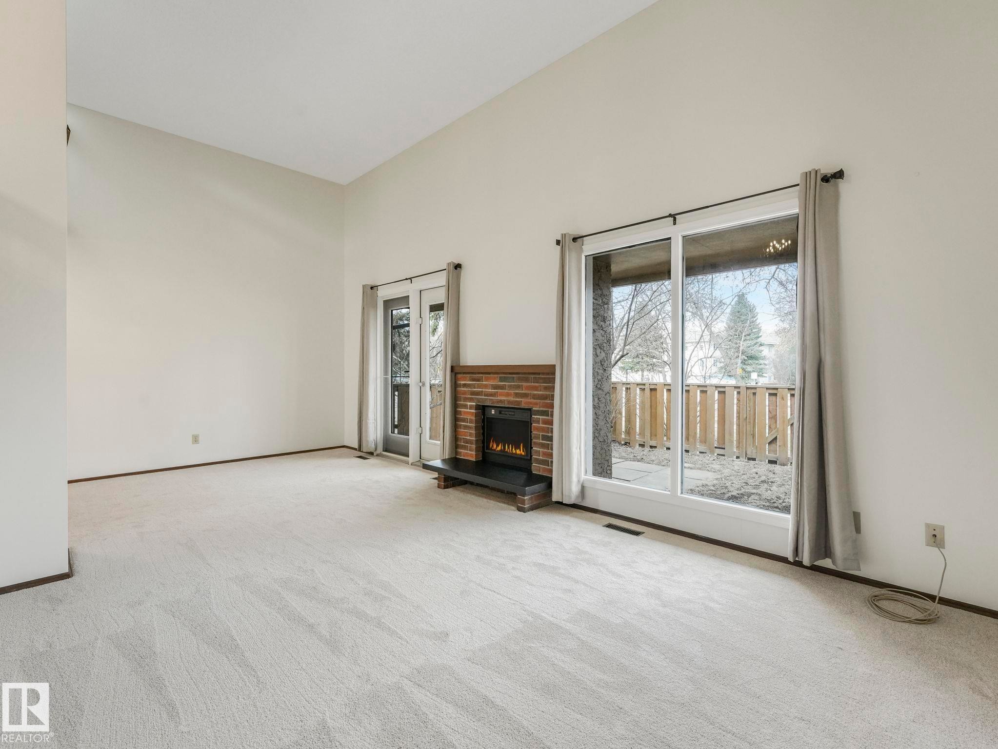33 Glaewyn, St. Albert, AB - Indoor Photo Showing Other Room With Fireplace