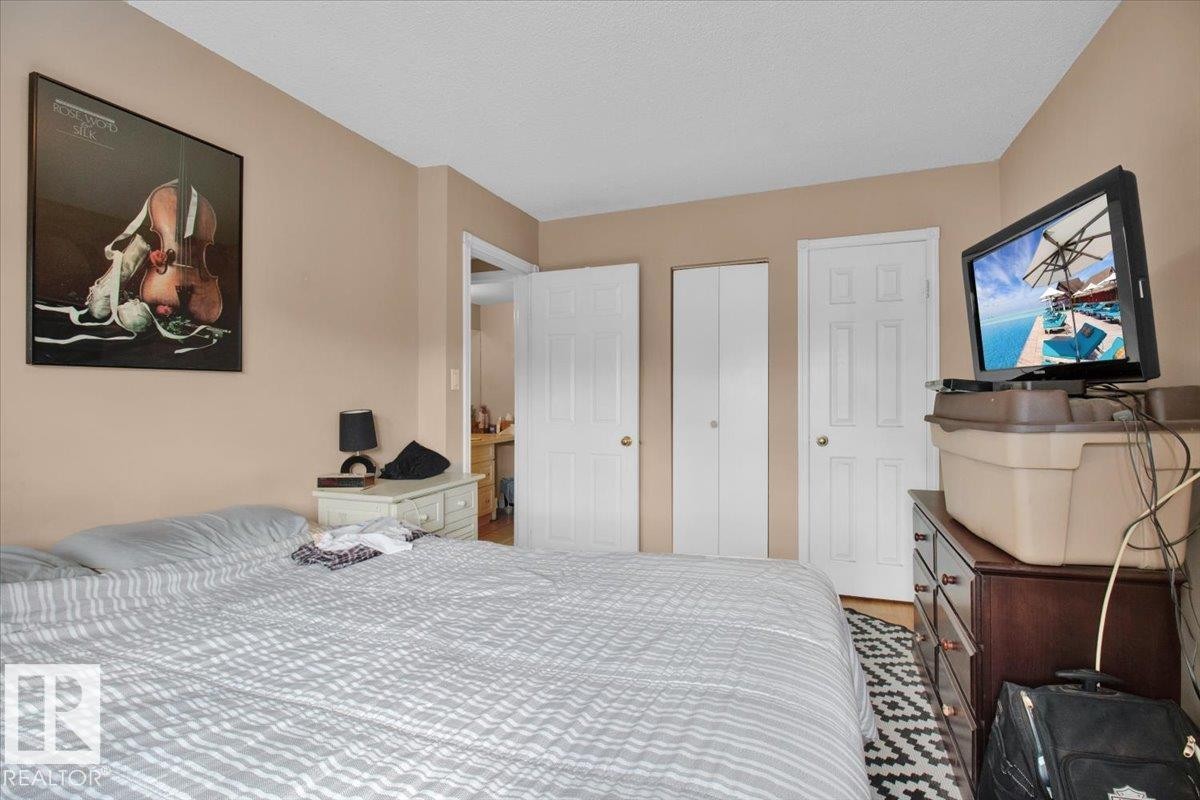This bedroom features light tan walls and white trim - 412 2908 116A Avenue, Edmonton, AB - Indoor Photo Showing Bedroom