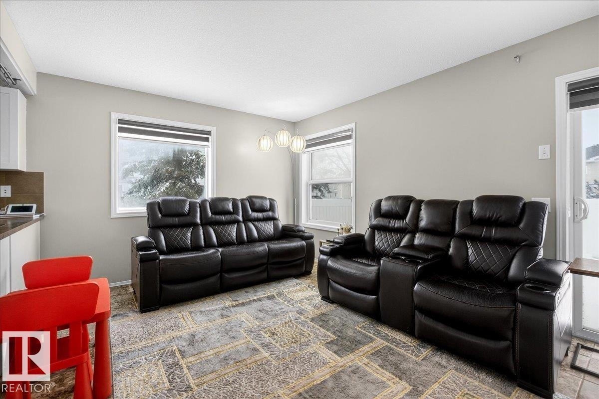 View of carpeted home theater room - 47 230 Edwards Drive, Edmonton, AB - Indoor Photo Showing Living Room