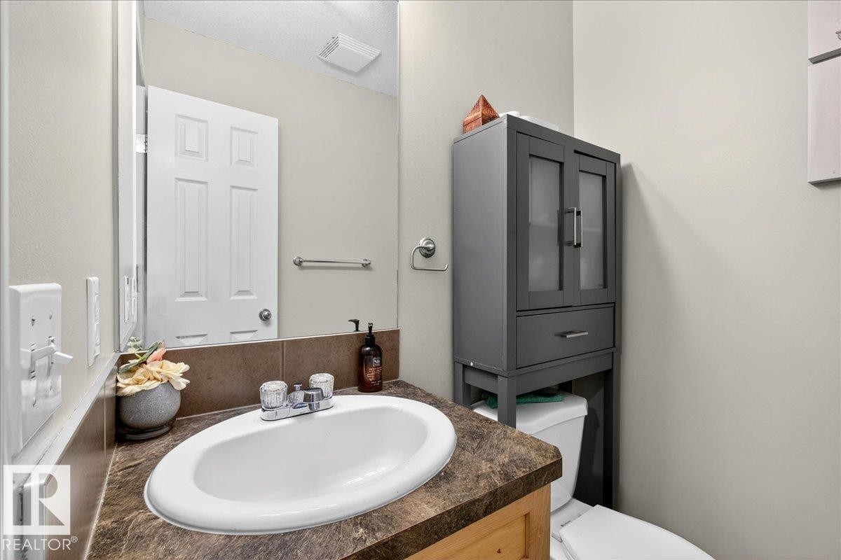 Bathroom featuring vanity and toilet - 47 230 Edwards Drive, Edmonton, AB - Indoor Photo Showing Bathroom