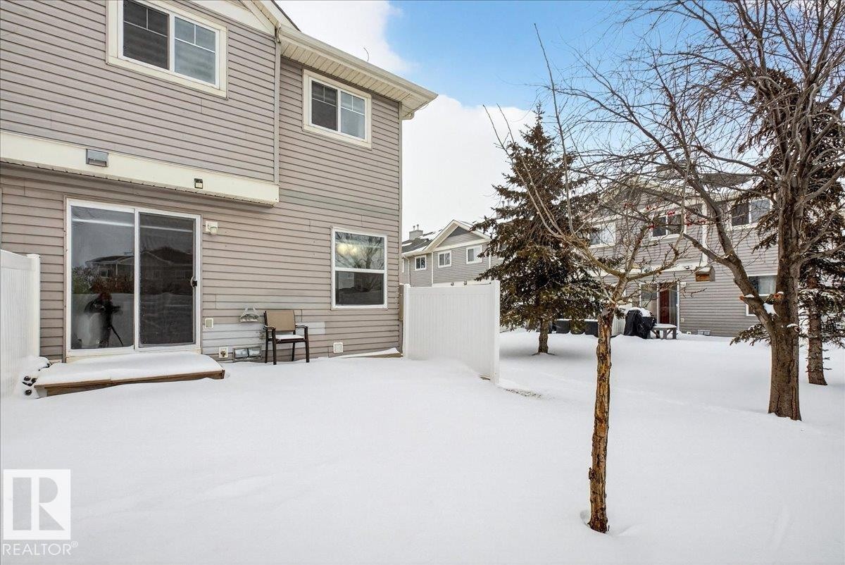 View of yard covered in snow - 47 230 Edwards Drive, Edmonton, AB - Outdoor