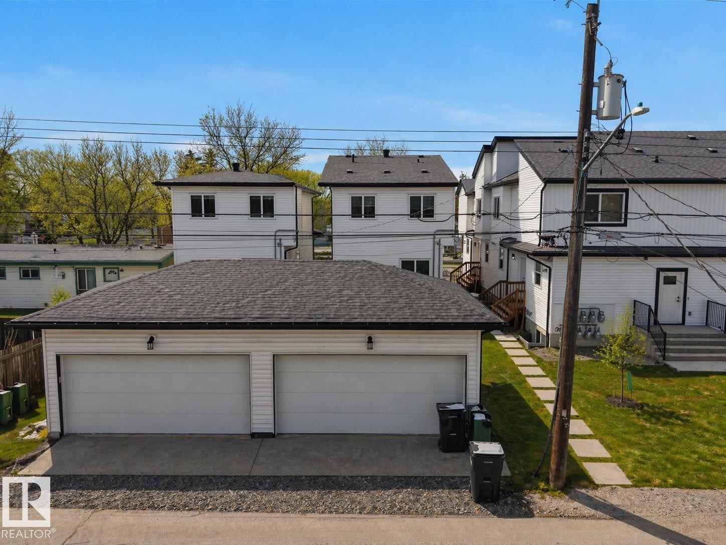 Two-car detached garage with white panel doors and an asphalt shingle roof - 10913 159 Street, Edmonton, AB - Outdoor