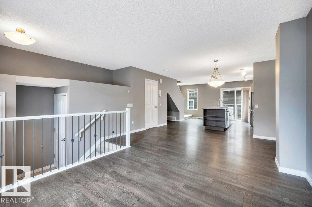 24 4050 Savaryn Drive, Edmonton, AB - Indoor Photo Showing Living Room