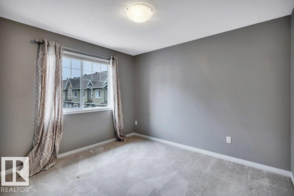 24 4050 Savaryn Drive, Edmonton, AB - Indoor Photo Showing Other Room
