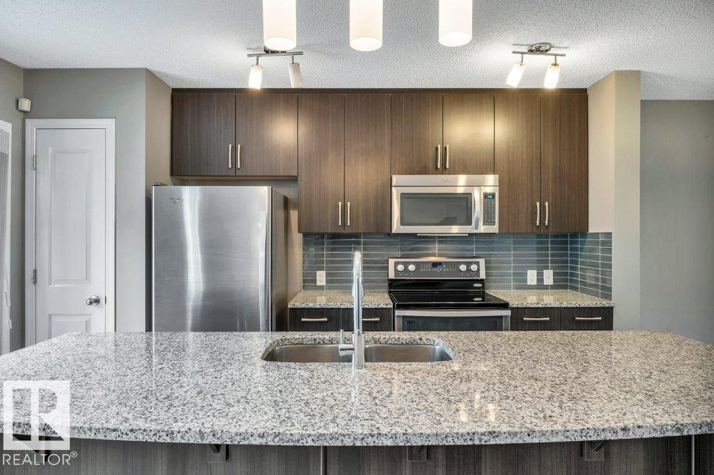 24 4050 Savaryn Drive, Edmonton, AB - Indoor Photo Showing Kitchen With Double Sink With Upgraded Kitchen