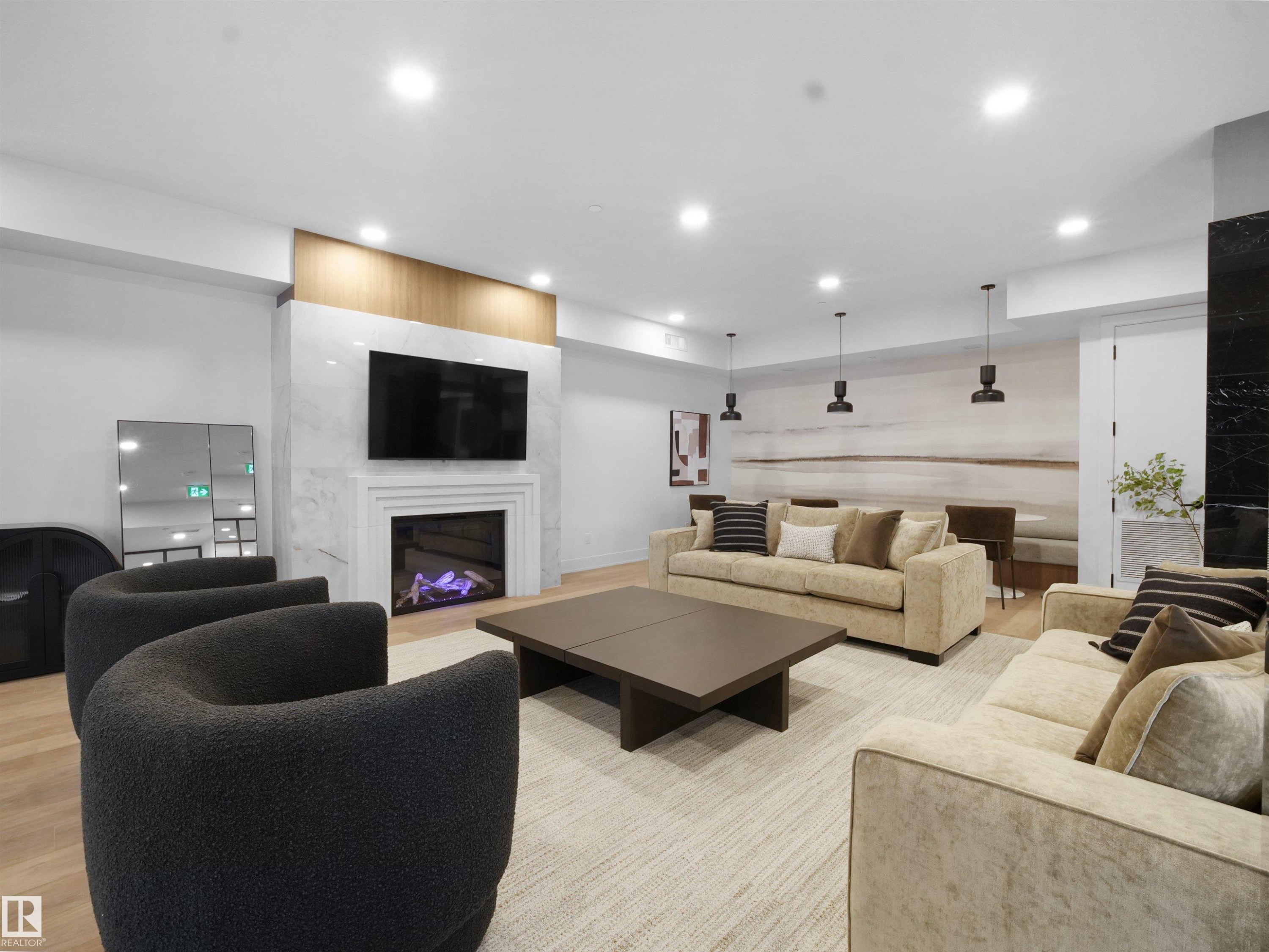 402 7459 May Common, Edmonton, AB - Indoor Photo Showing Living Room With Fireplace